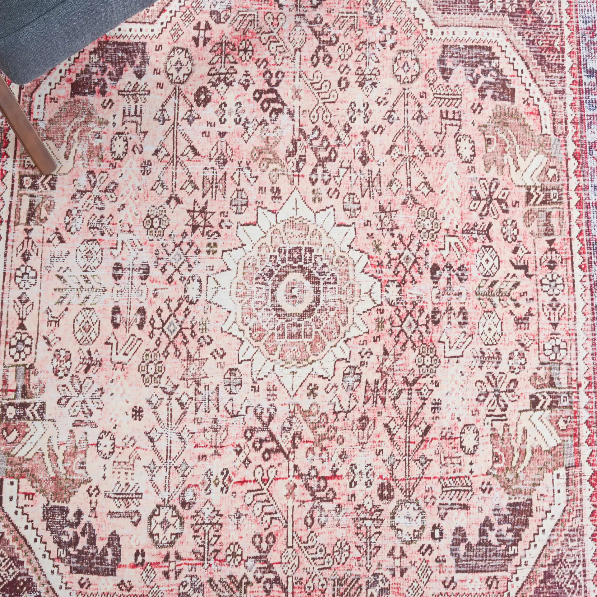 Tucson Distressed Elongated Octagon Medallion Washable Rug in Beige / Red in a styled room