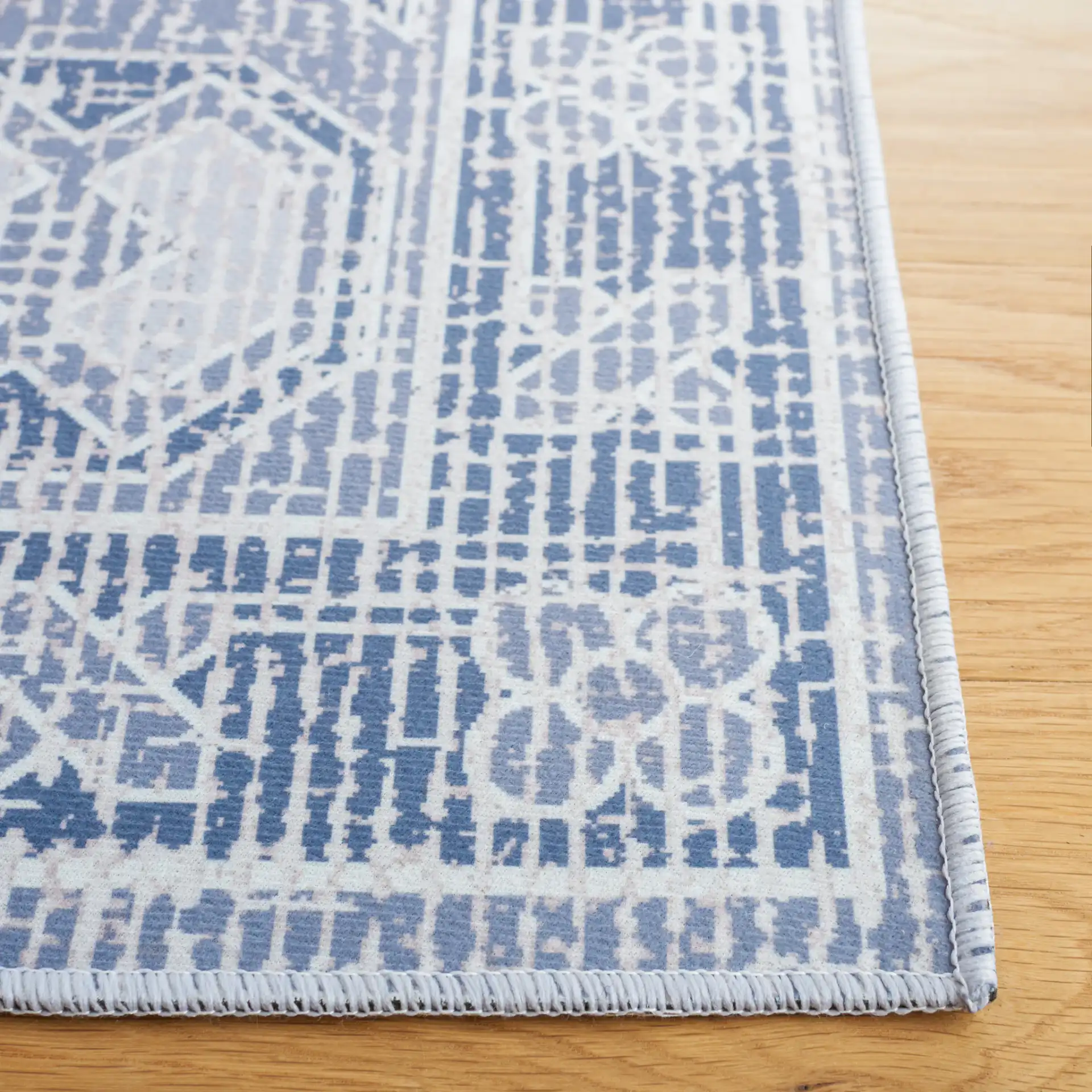 Tucson Triple Diamond Washable Rug in Gray / Ivory in a styled room