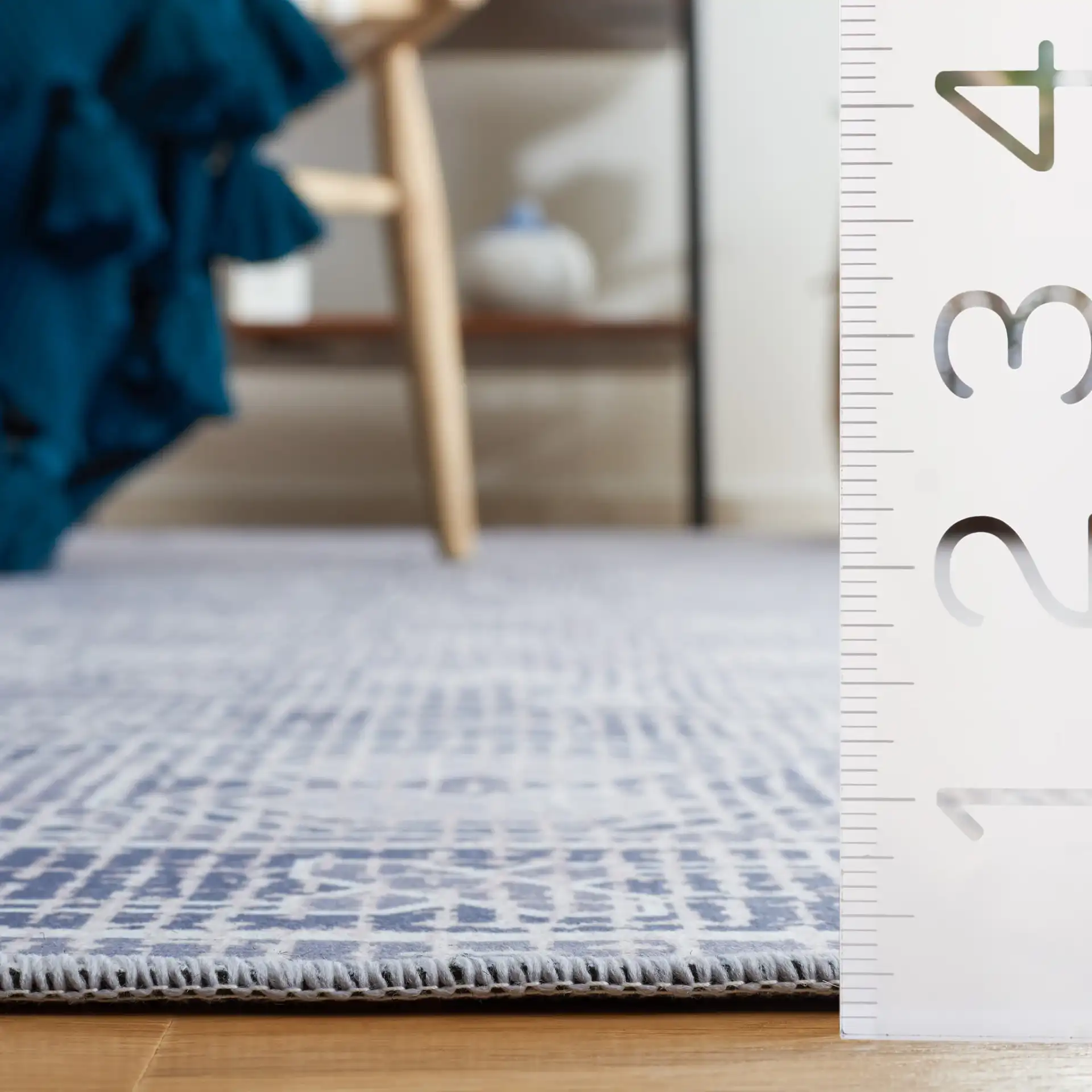 Tucson Triple Diamond Washable Rug in Gray / Ivory in a styled room