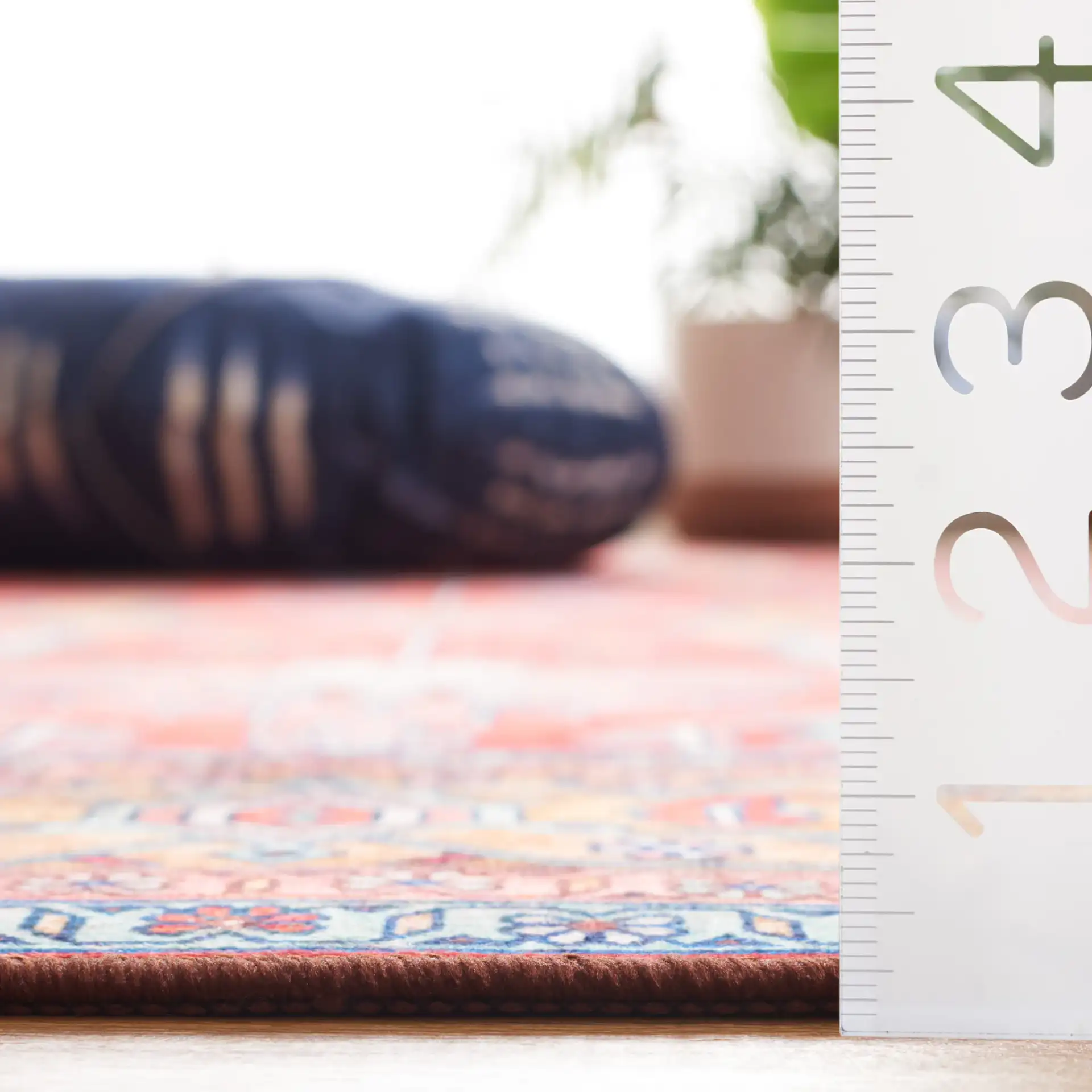 Tucson Traditional Allover Washable Rug in Rust / Navy in a styled room