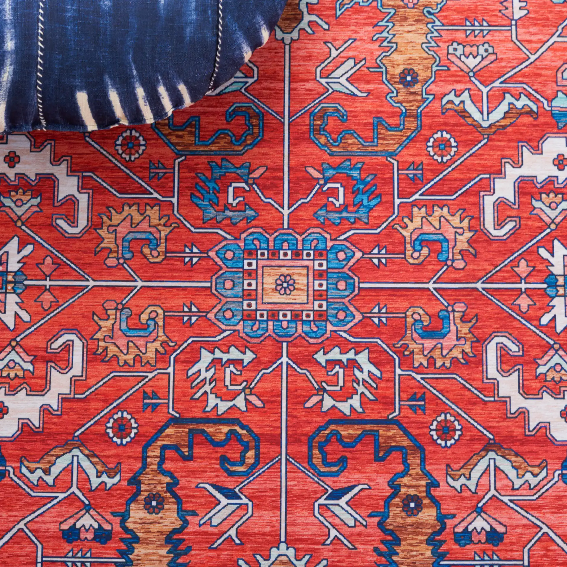 Tucson Traditional Allover Washable Rug in Rust / Navy in a styled room