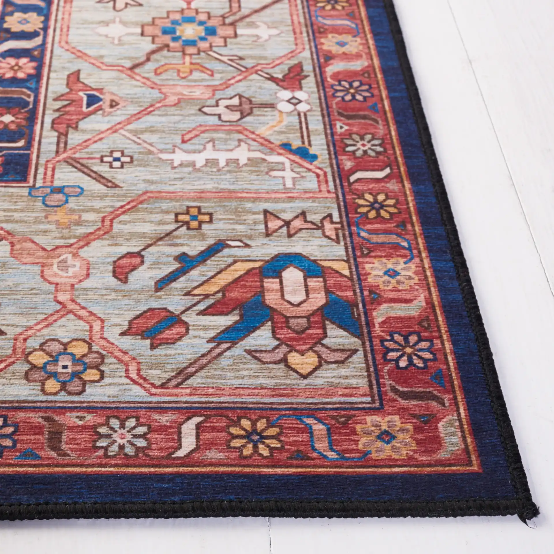 Tucson Diamond Medallion Washable Rug in Rust / Blue in a styled room