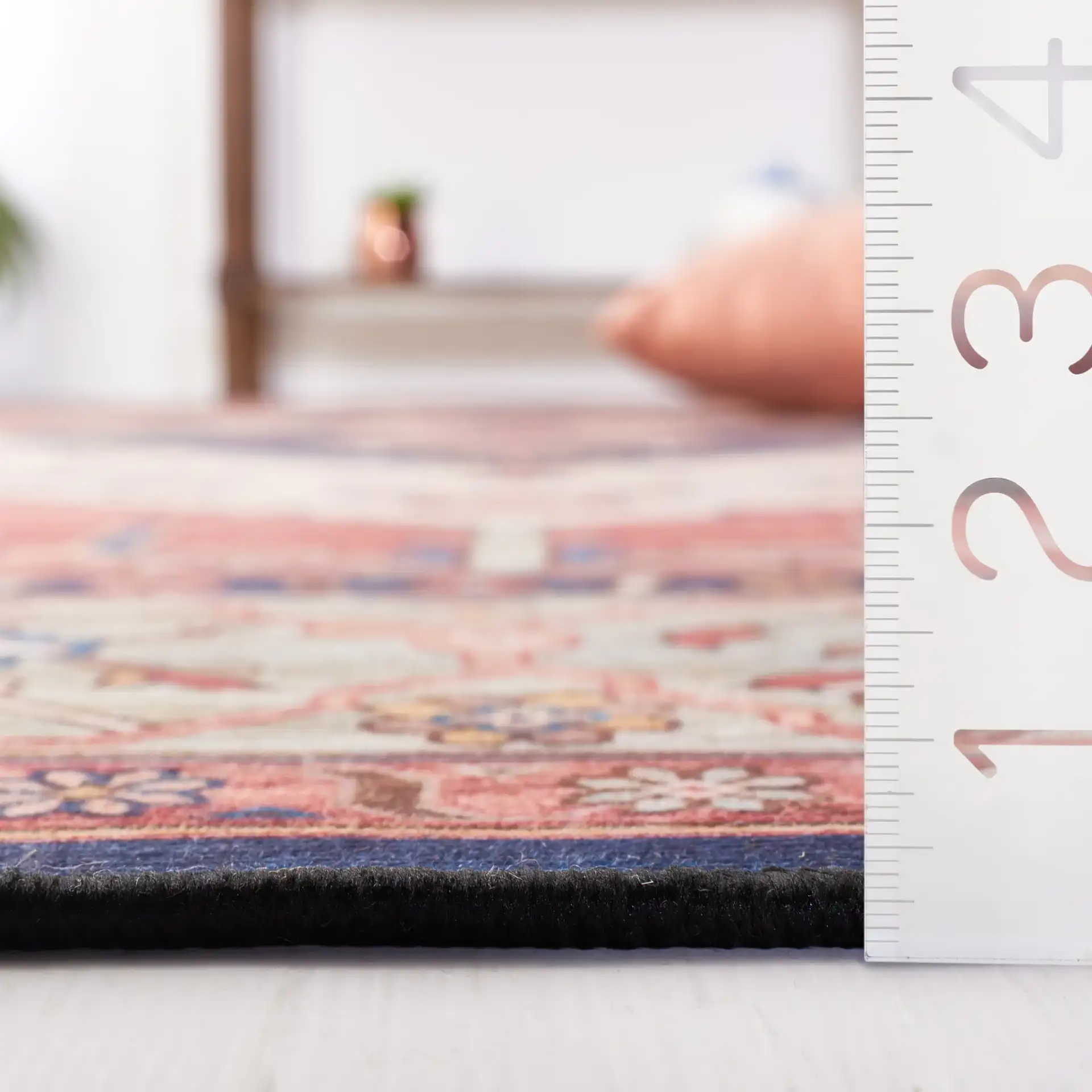 Tucson Diamond Medallion Washable Rug in Rust / Blue in a styled room