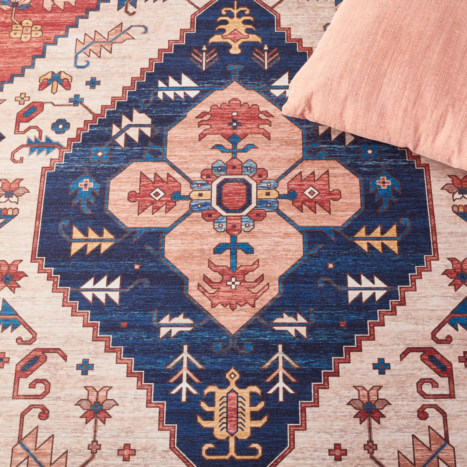 Tucson Diamond Medallion Washable Rug in Rust / Blue in a styled room