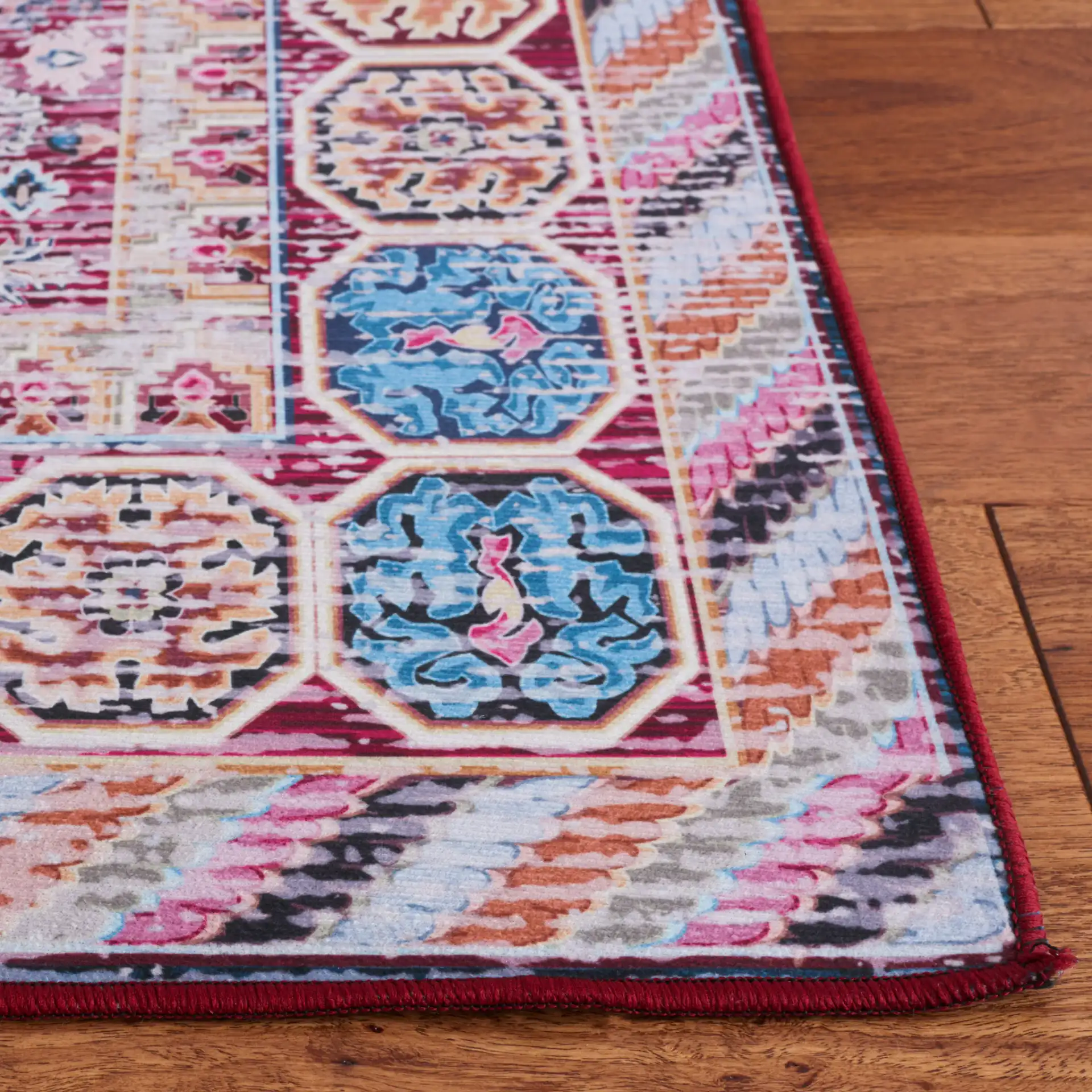 Tucson Triple Medallion Washable Rug in Blue / Red in a styled room
