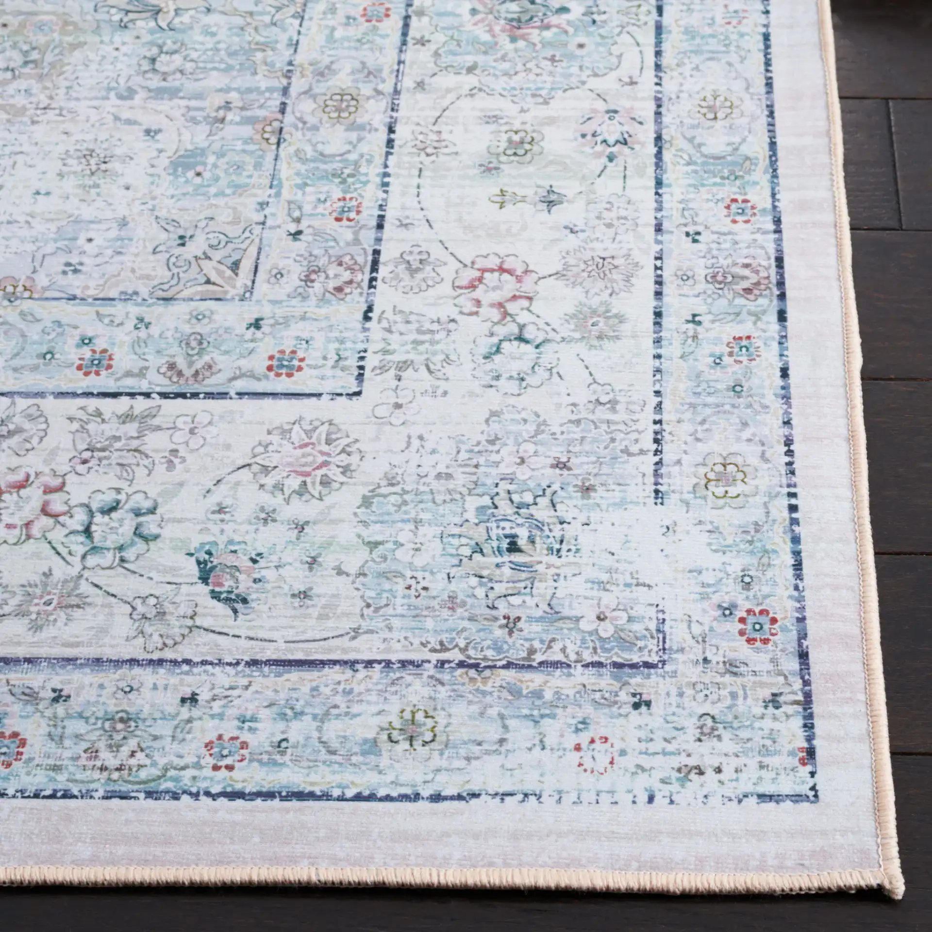 Tucson Distressed Floral Medallion Washable Rug in Beige / Green in a styled room