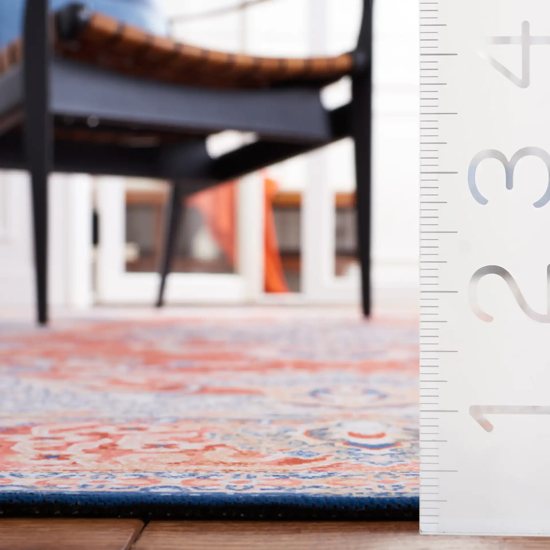 Tucson Arabesque Medallion Washable Rug in Rust / Blue in a styled room