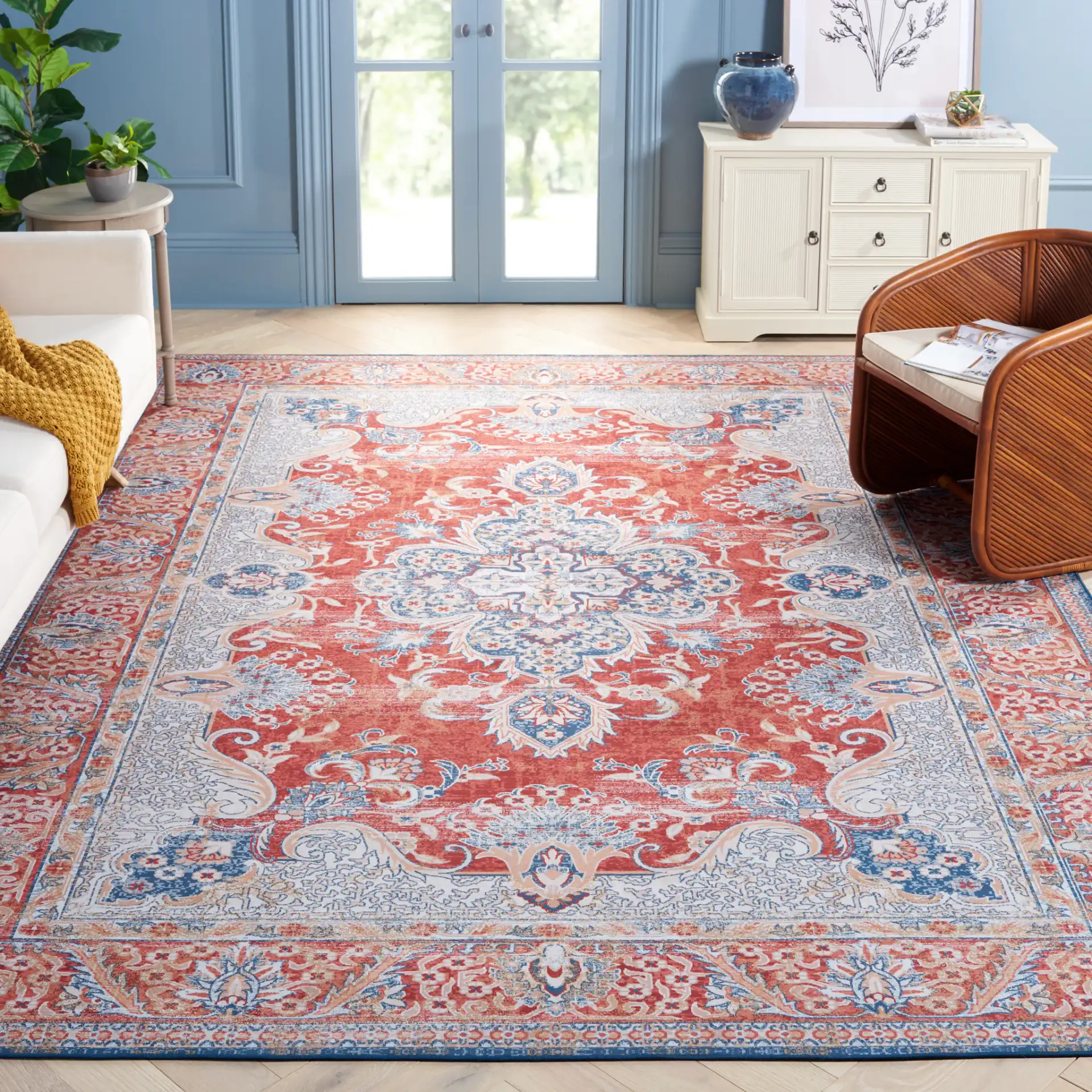 Tucson Arabesque Medallion Washable Rug in Rust / Blue in a styled room