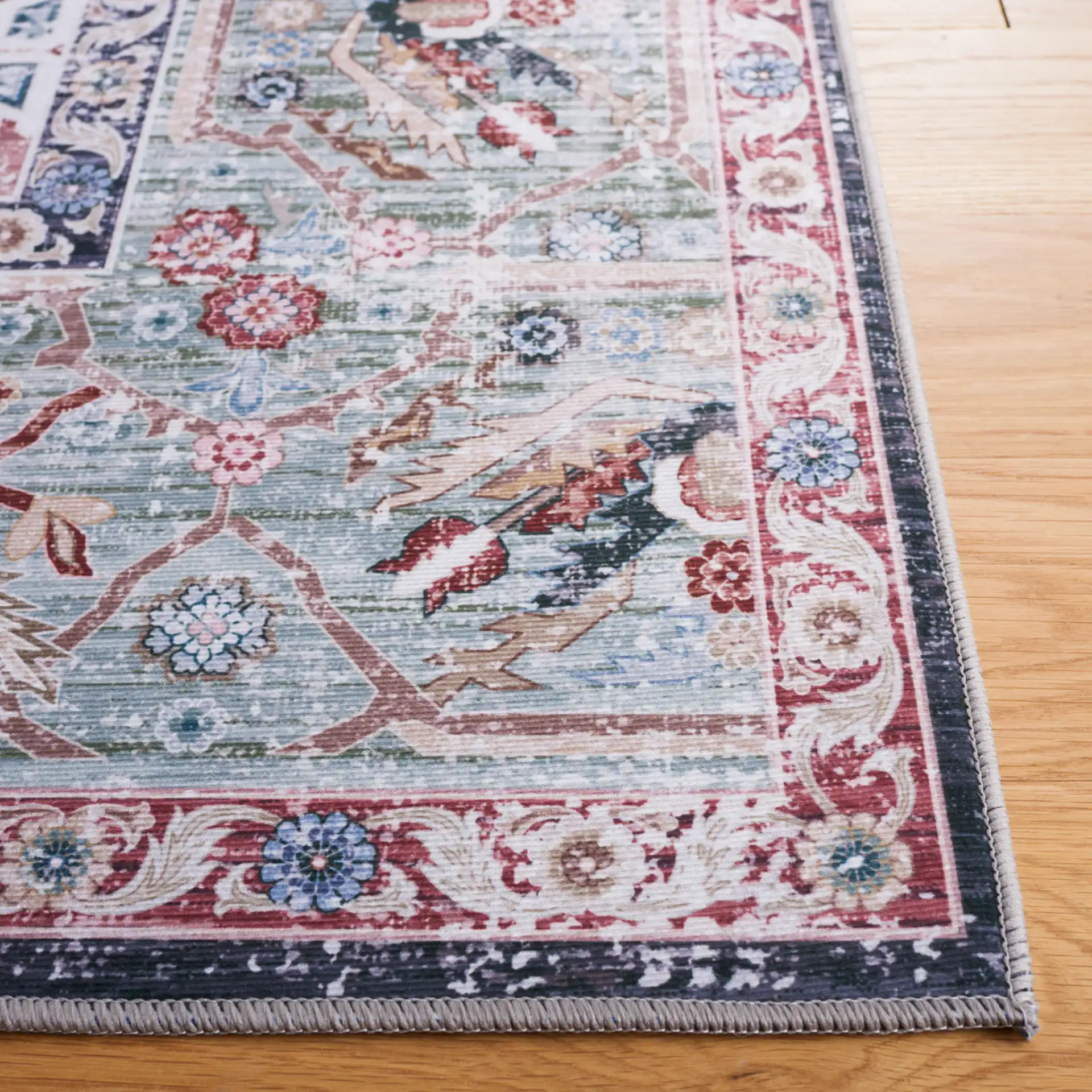 Tucson Nested Stepped Diamond Medallion Washable Rug in Rust / Navy in a styled room