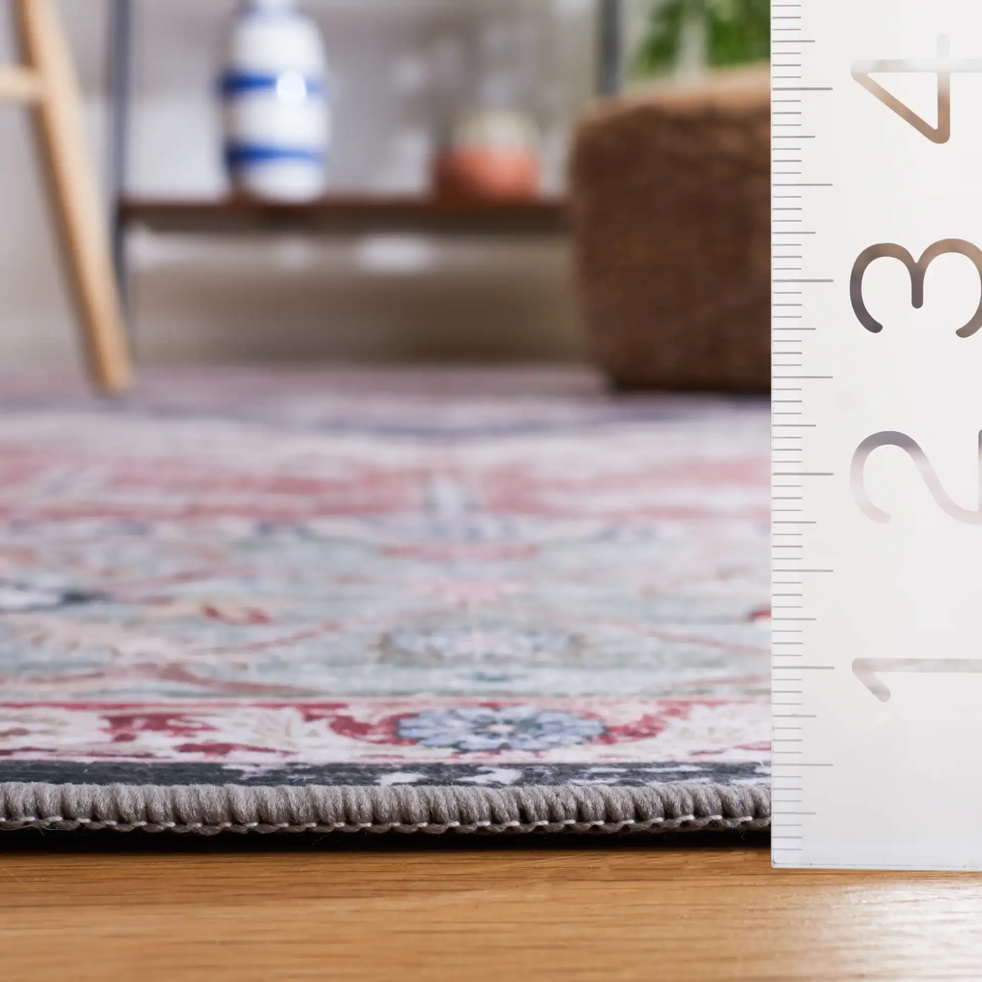 Tucson Nested Stepped Diamond Medallion Washable Rug in Rust / Navy in a styled room
