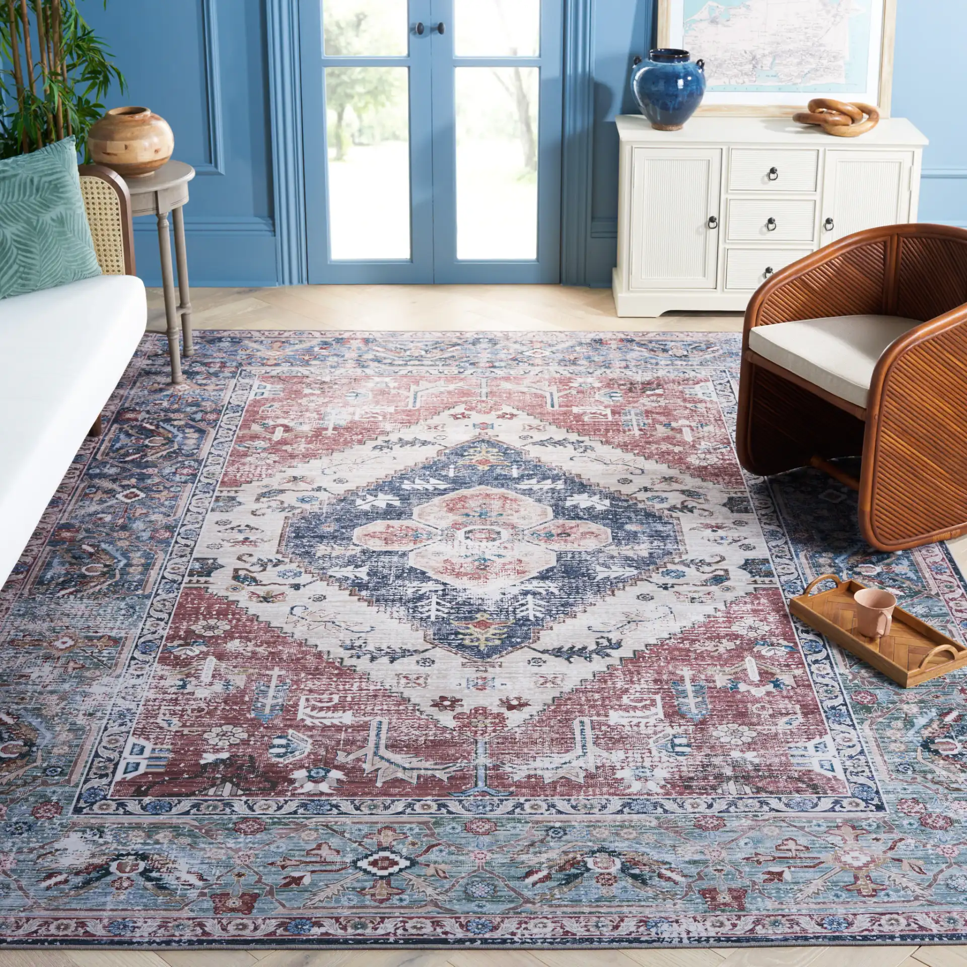 Tucson Nested Stepped Diamond Medallion Washable Rug in Rust / Navy in a styled room