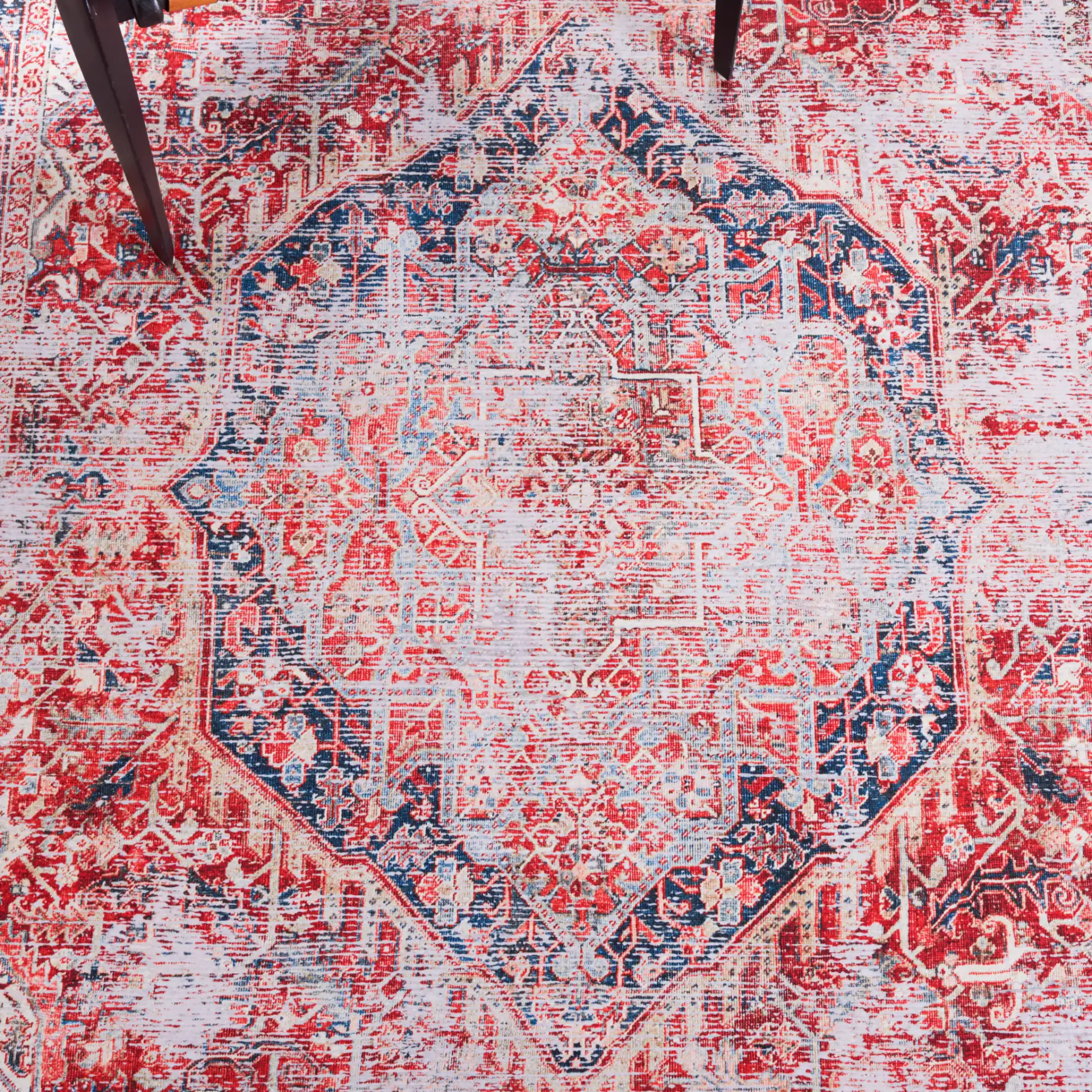 Tucson Distressed Hexagon Medallion Washable Rug in Rust / Navy in a styled room