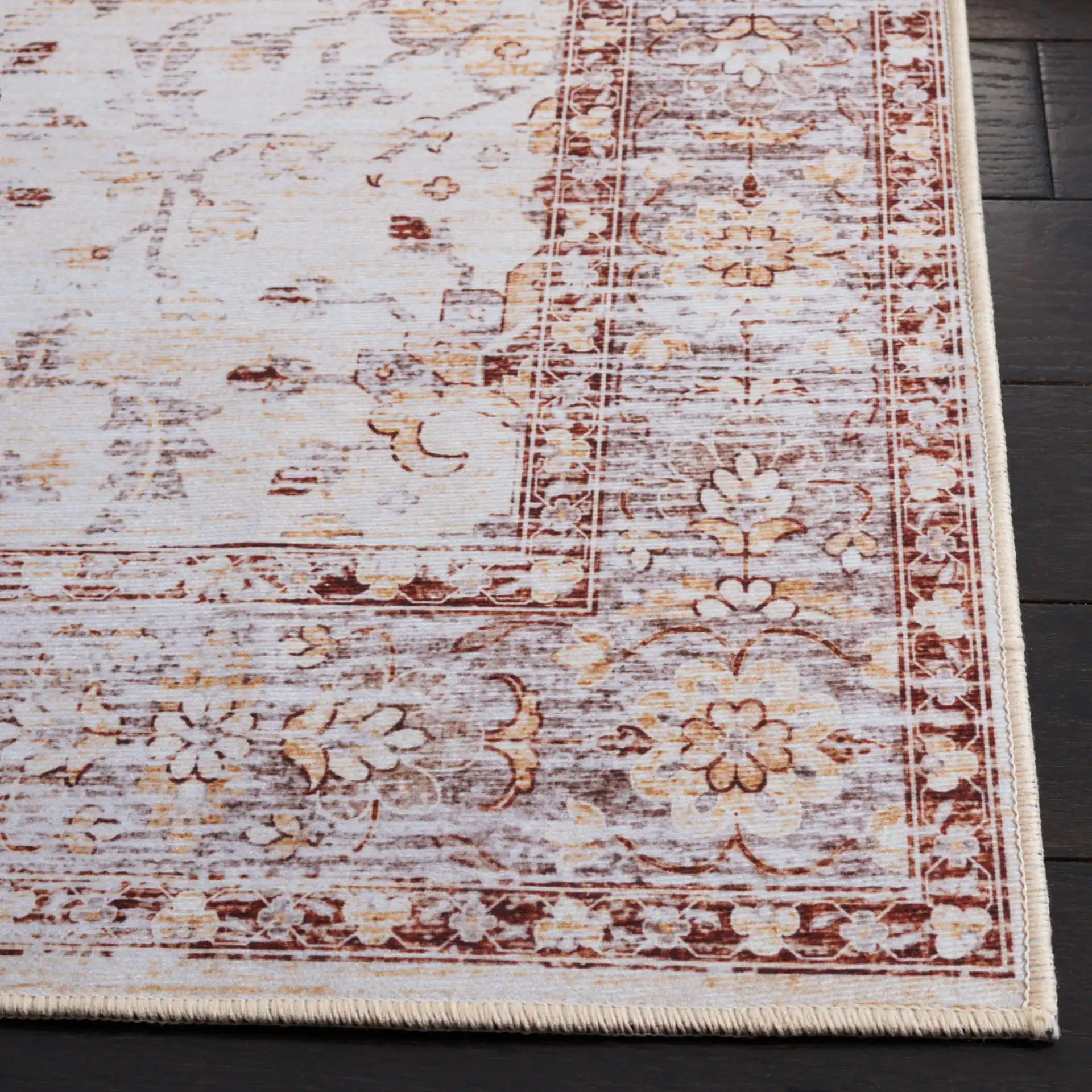 Tucson Faded Floral Washable Rug in Beige / Gold in a styled room
