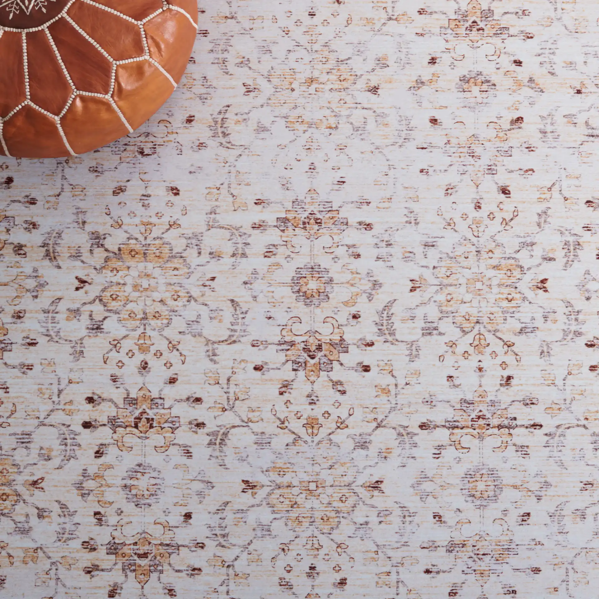 Tucson Faded Floral Washable Rug in Beige / Gold in a styled room
