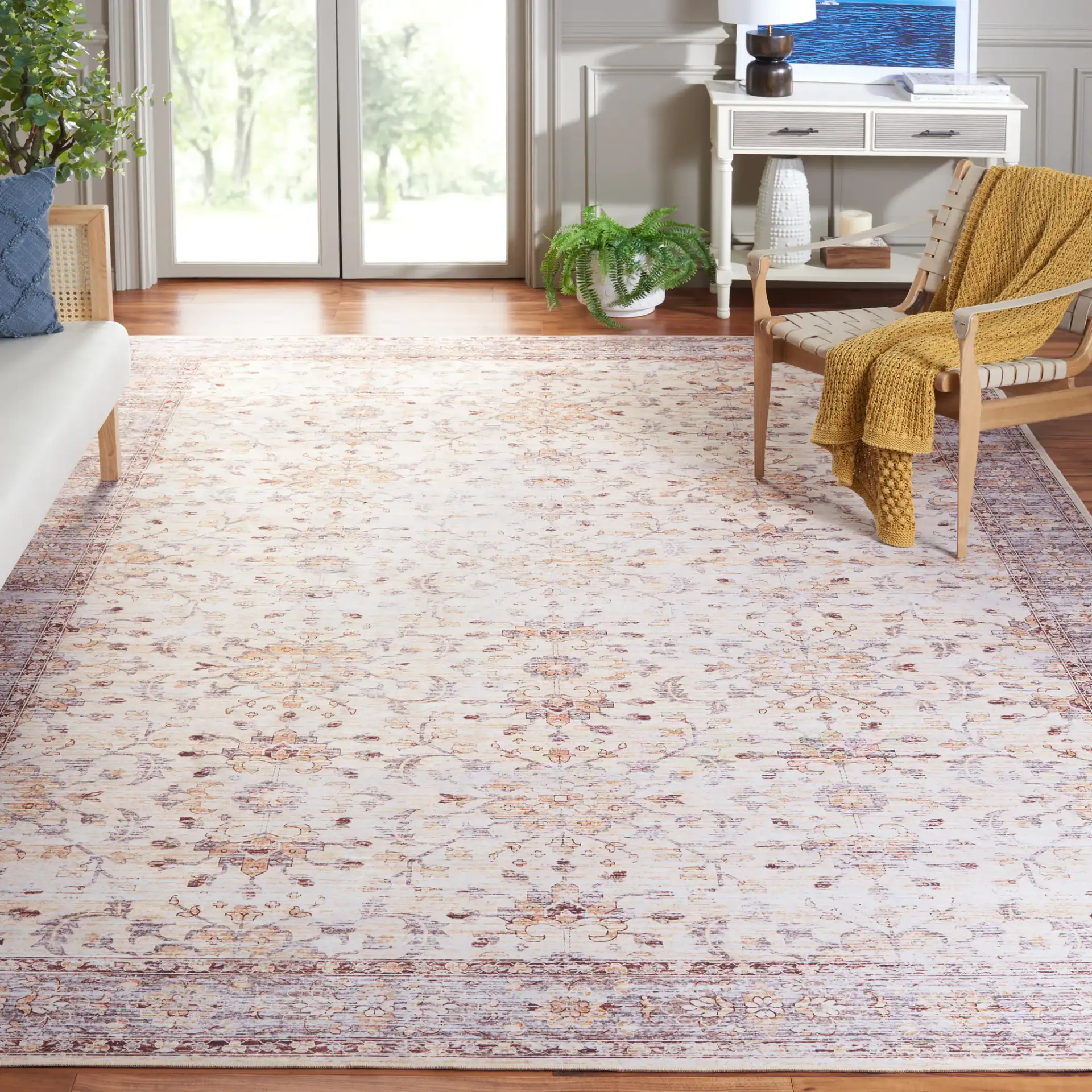Tucson Faded Floral Washable Rug in Beige / Gold in a styled room