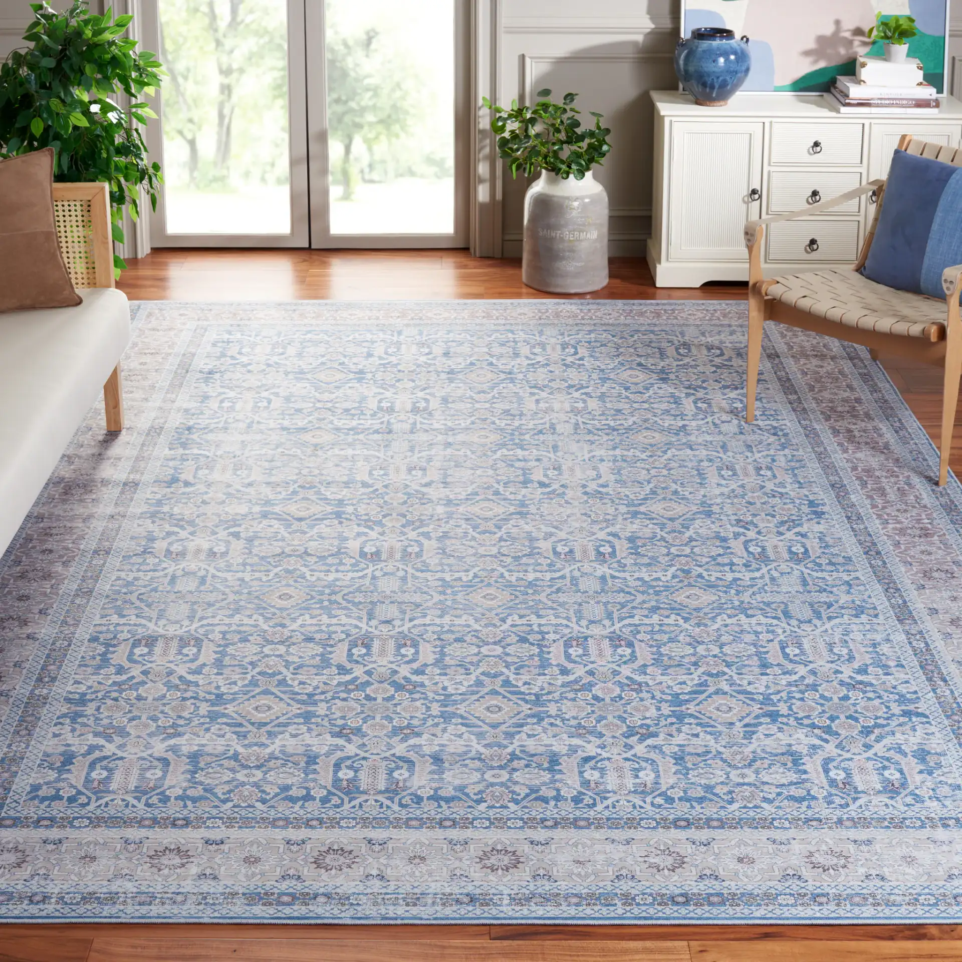 Tucson Allover Floral Washable Rug in Blue / Rust in a styled room