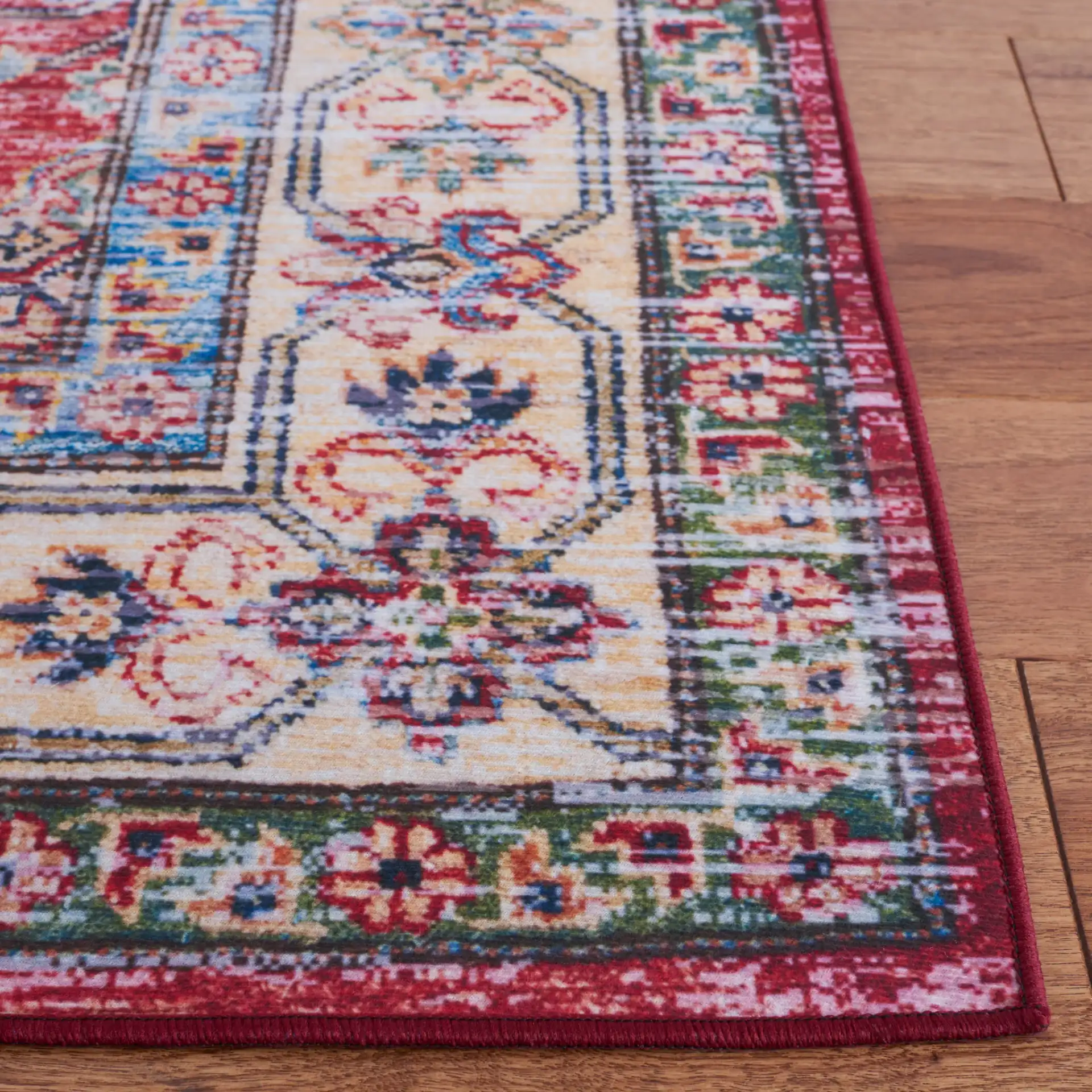 Tucson Medallion Bordered Washable Rug in Rust / Beige in a styled room