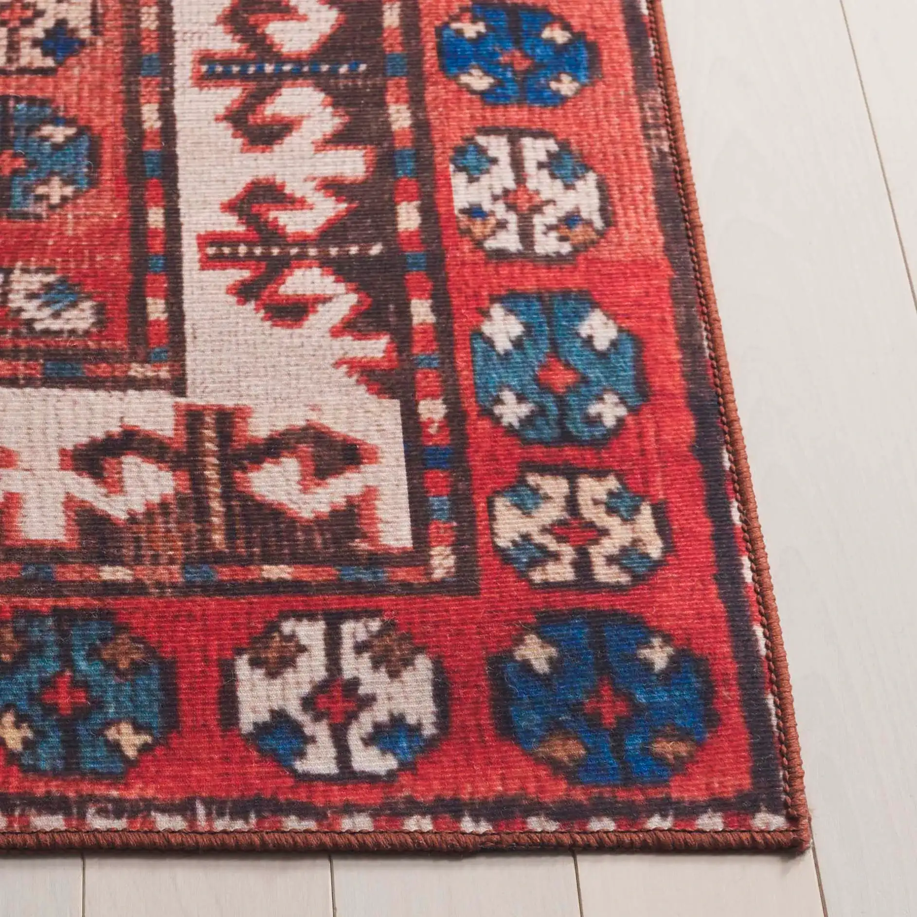 Tucson Southwestern Octagon Medallion Washable Rug in Navy / Rust in a styled room