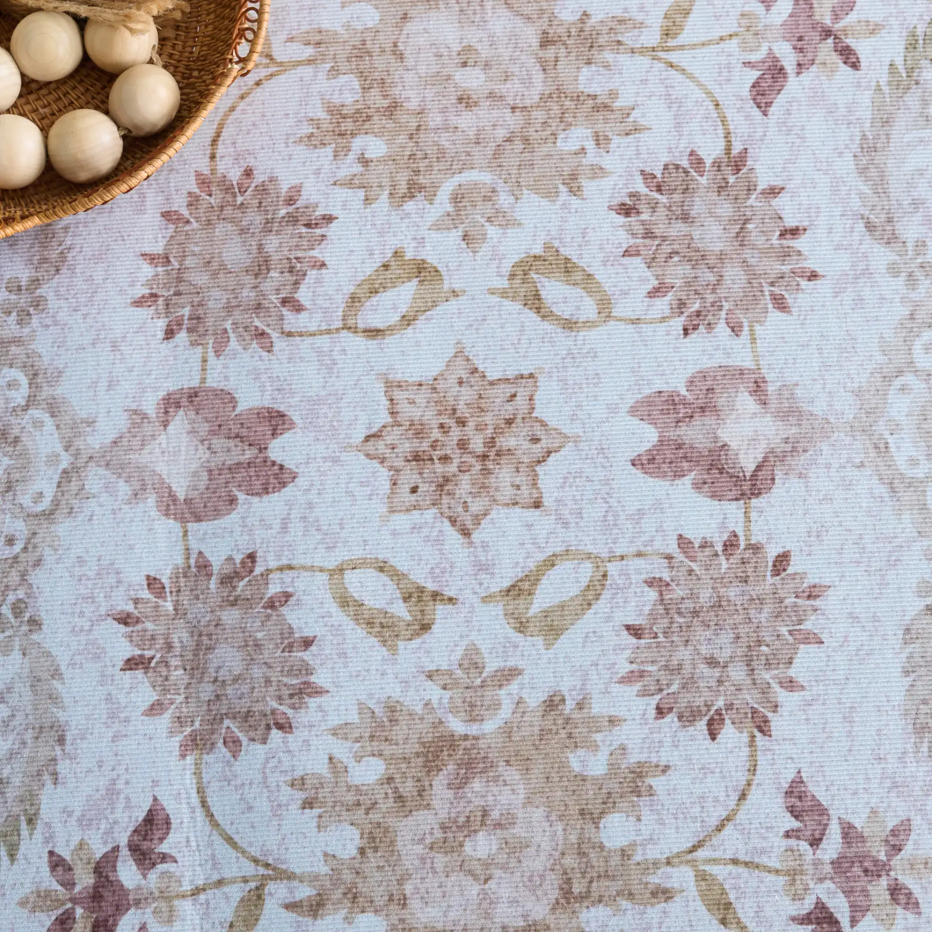 Tucson Vine Floral Bordered Washable Rug in Beige / Light Brown in a styled room