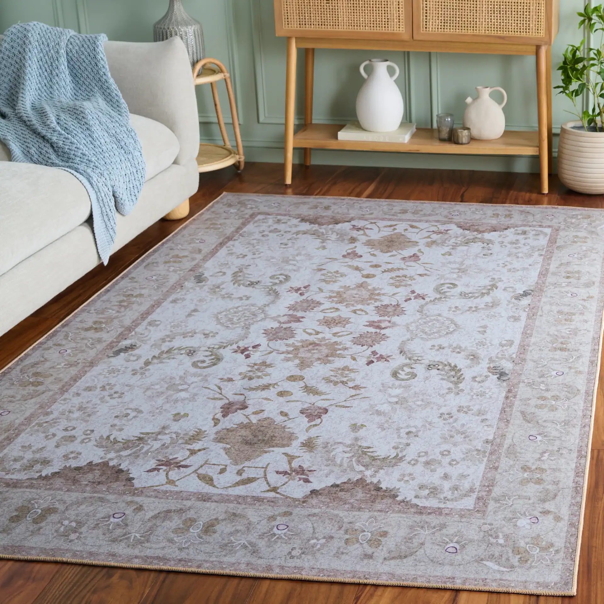 Tucson Vine Floral Bordered Washable Rug in Beige / Light Brown in a styled room