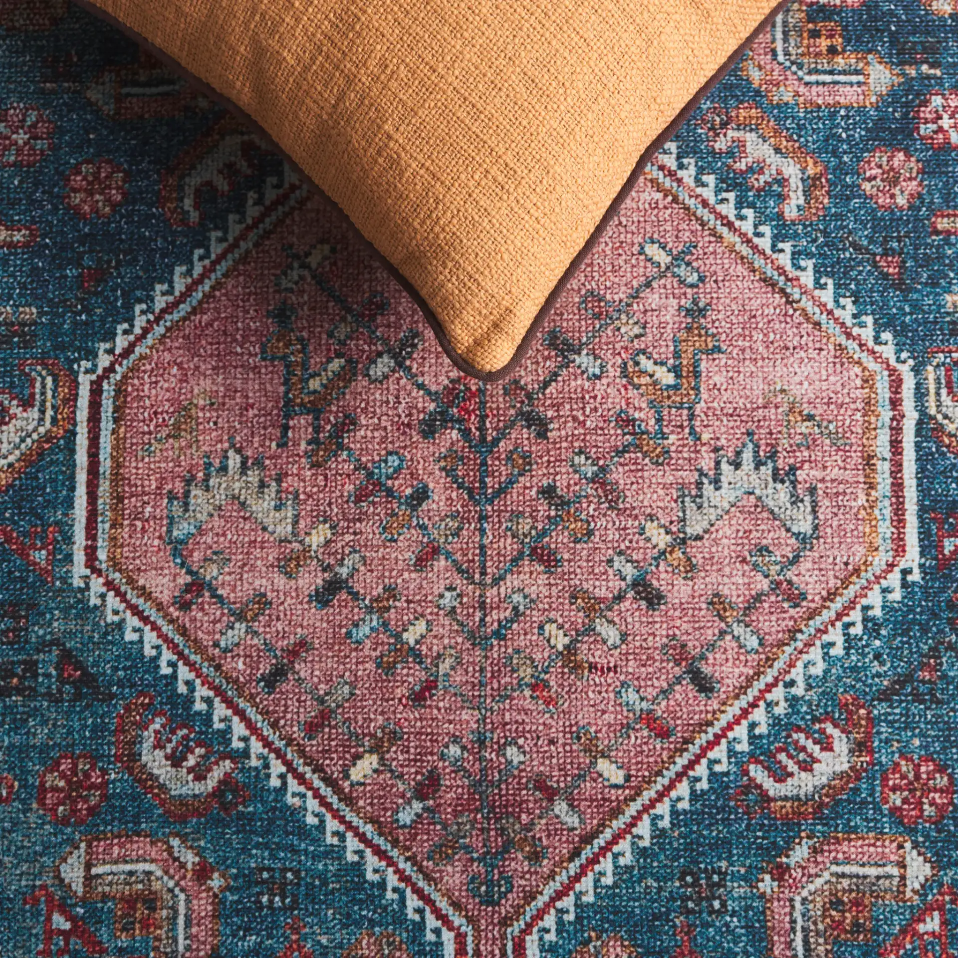 Tucson Tribal Pointed Diamond Medallion Washable Rug in Blue / Rust in a styled room