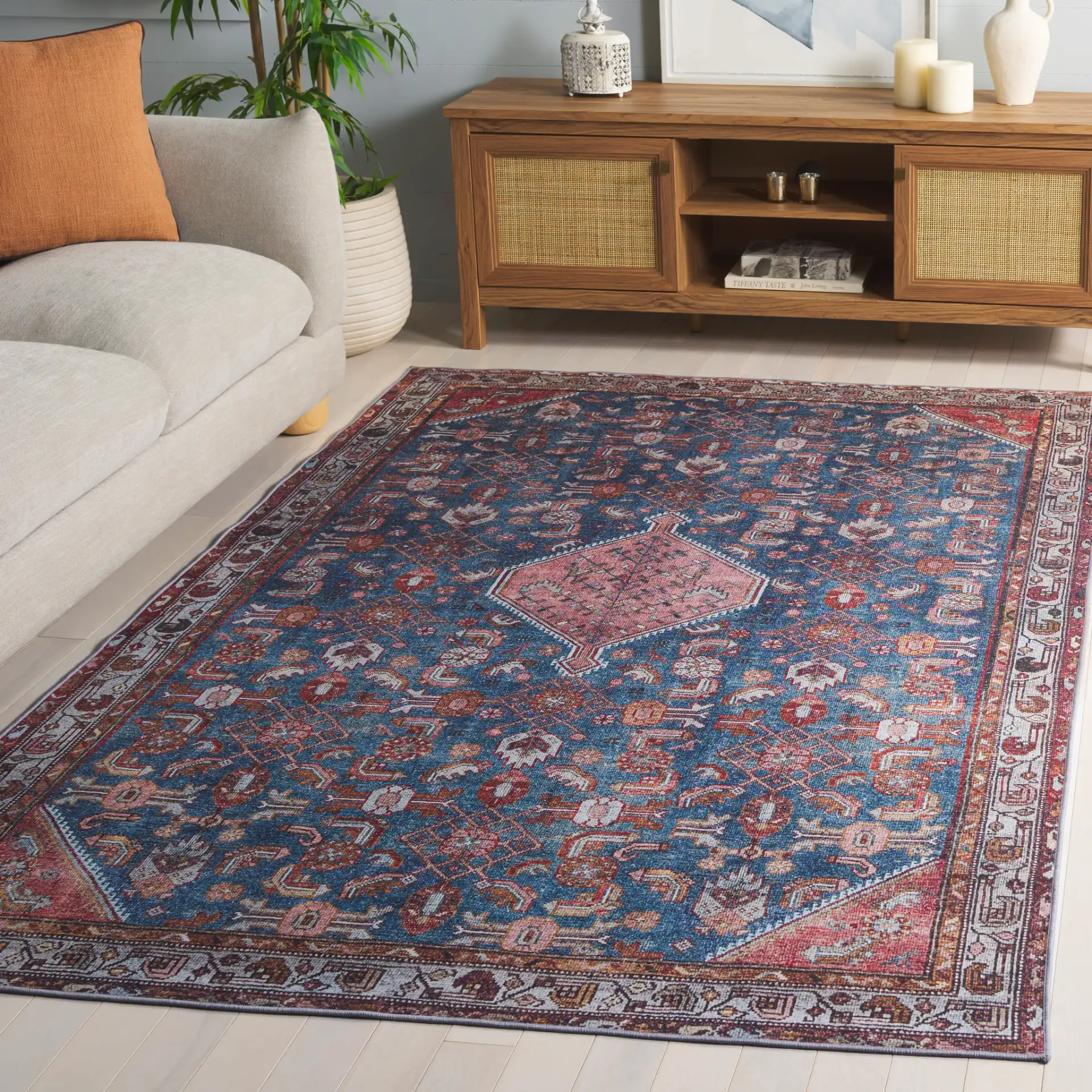 Tucson Tribal Pointed Diamond Medallion Washable Rug in Blue / Rust in a styled room