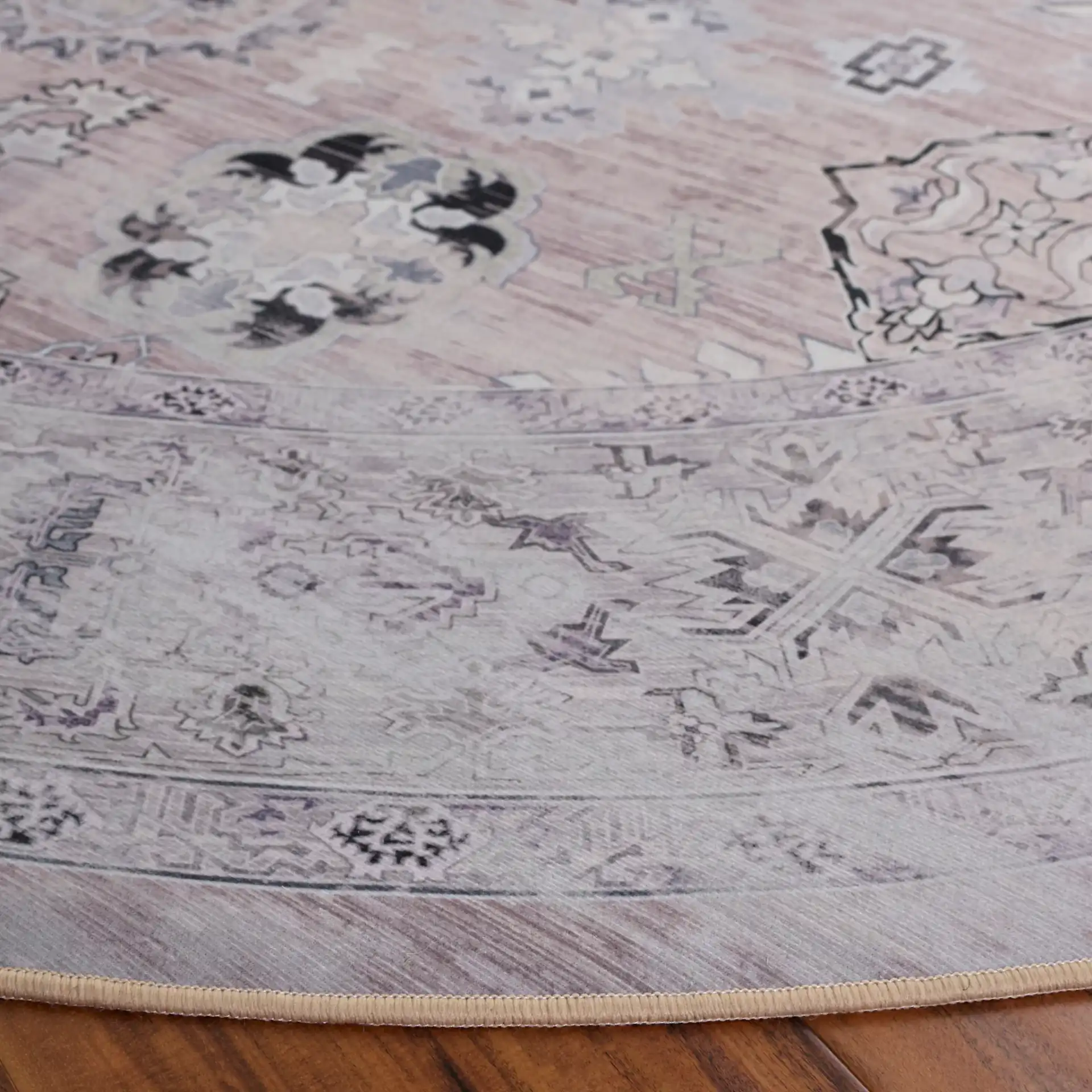 Tucson Distressed Medallion Washable Rug in Pink / Beige in a styled room