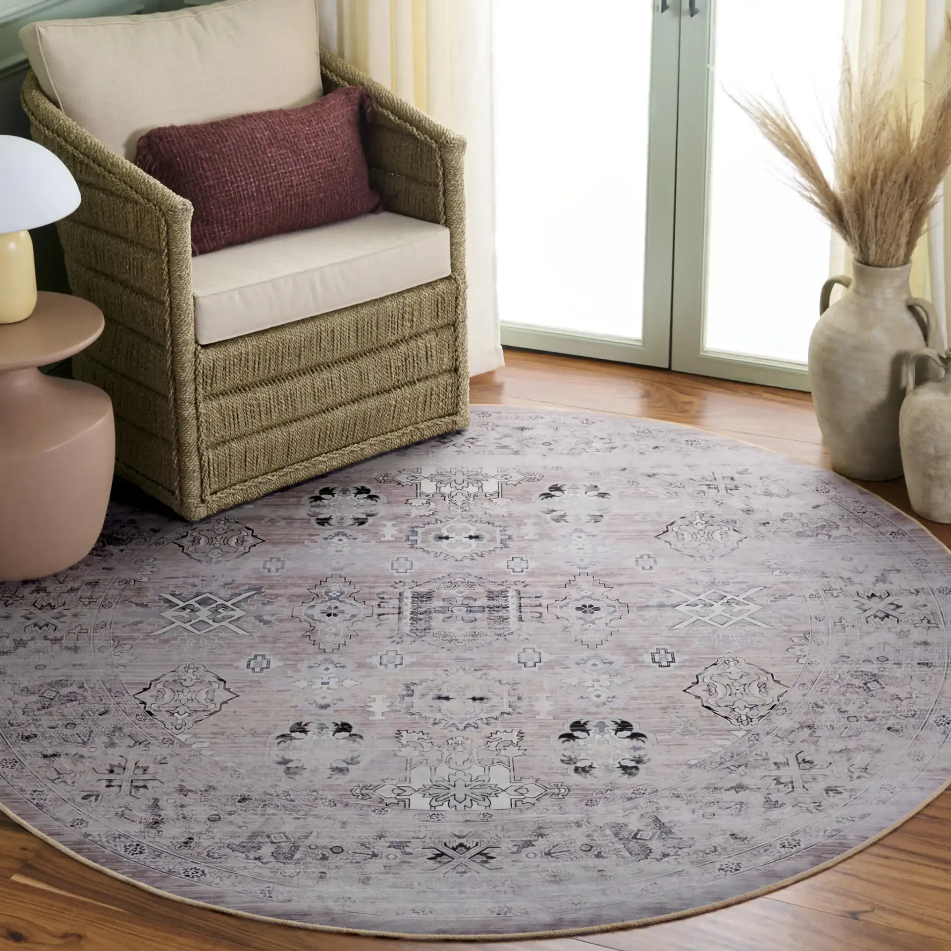 Tucson Distressed Medallion Washable Rug in Pink / Beige in a styled room