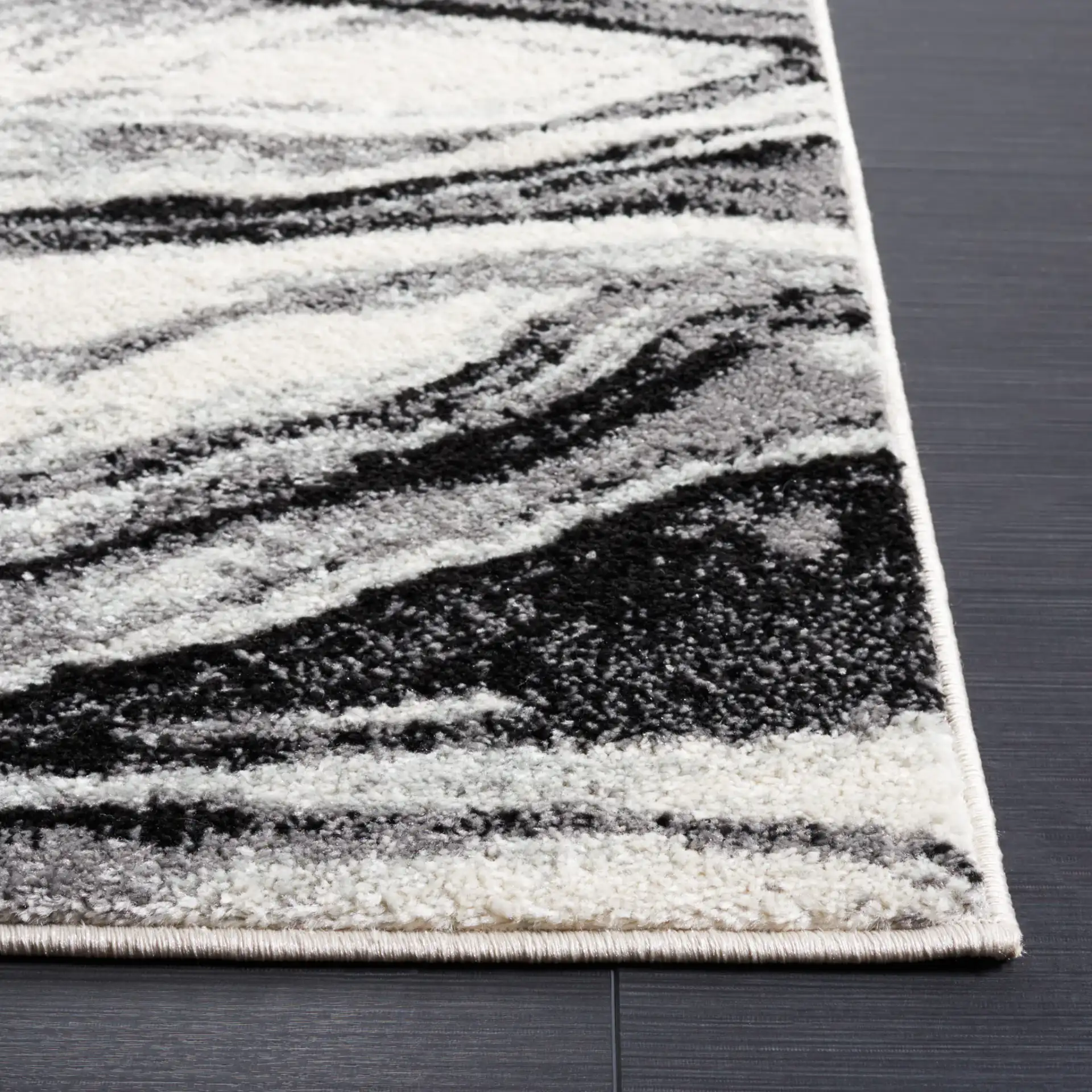 Tulum Marbled Waves Rug in Ivory / Black in a styled room