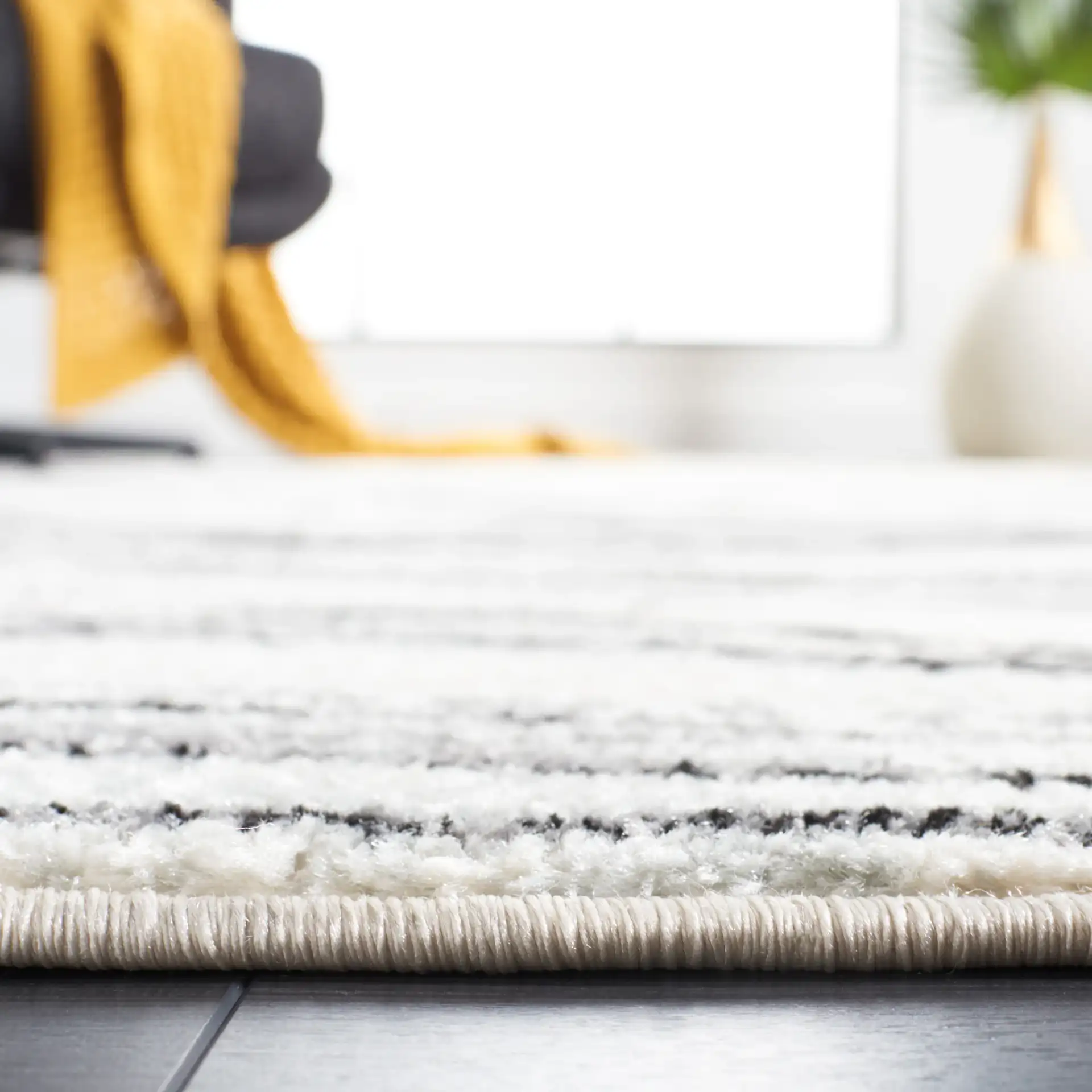 Tulum Marbled Waves Rug in Ivory / Black in a styled room