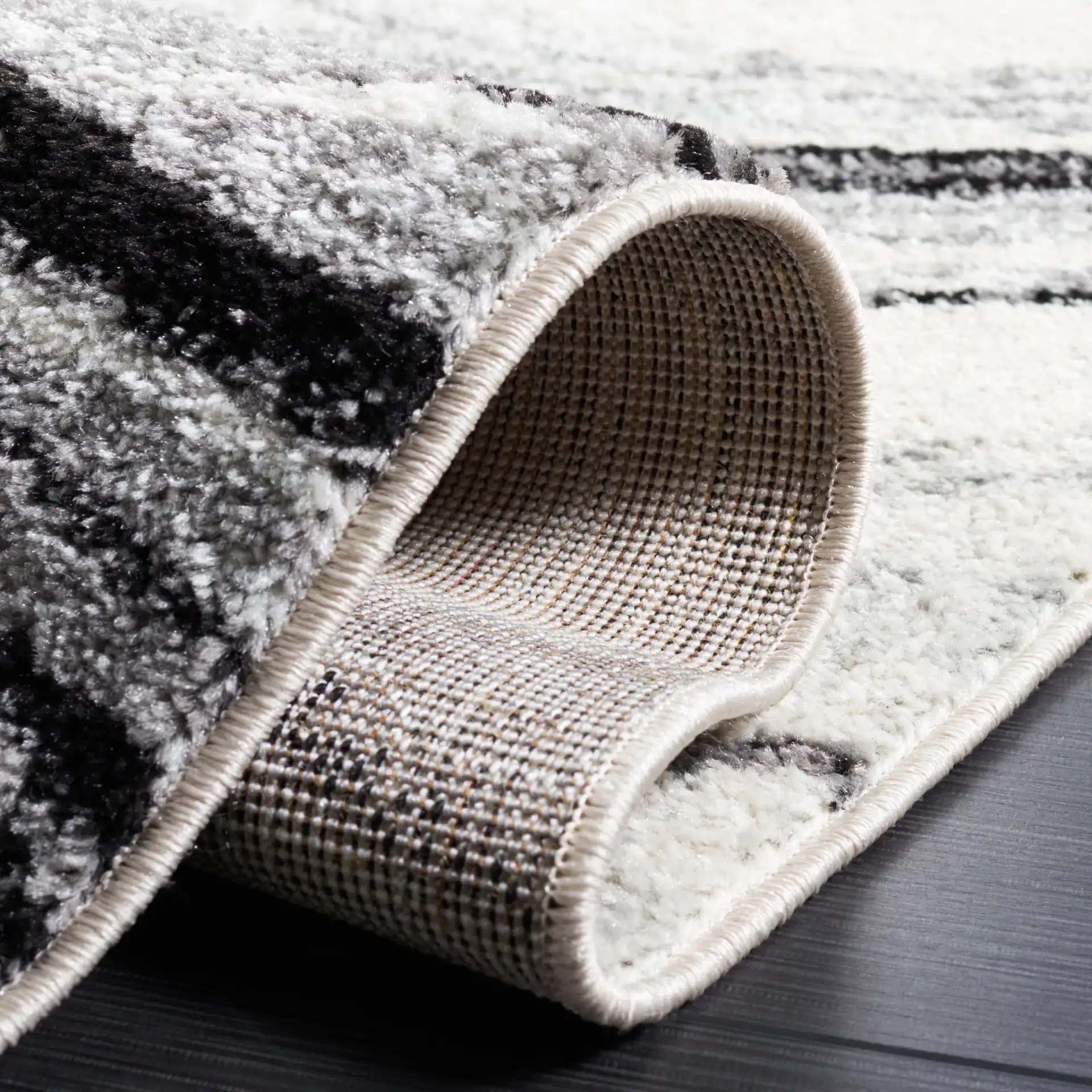 Tulum Marbled Waves Rug in Ivory / Black in a styled room