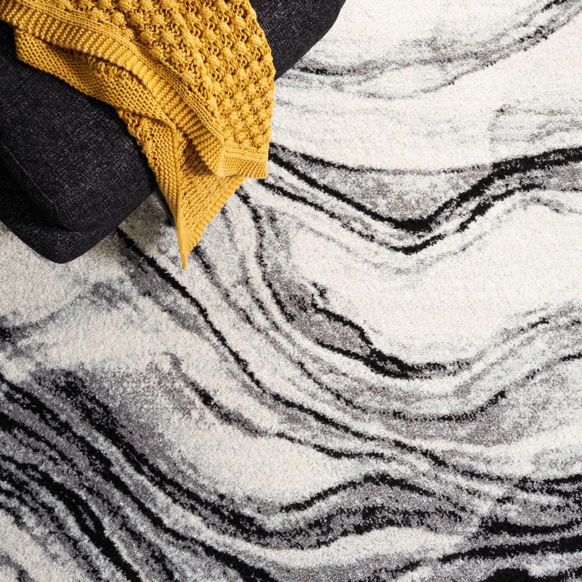 Tulum Marbled Waves Rug in Ivory / Black in a styled room
