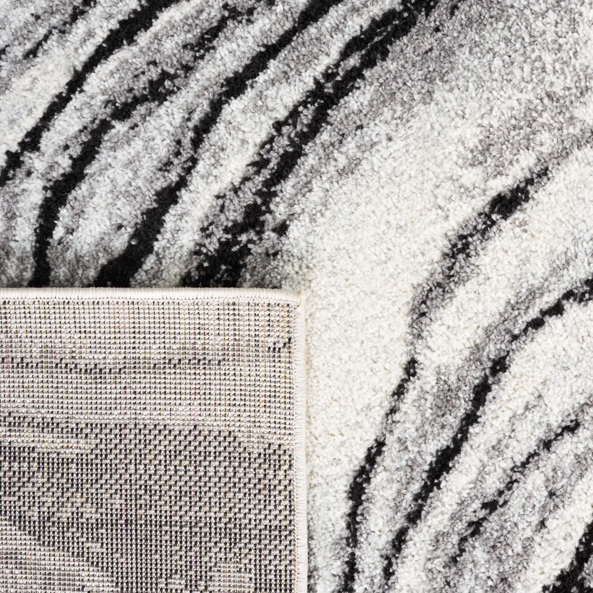 Tulum Marbled Waves Rug in Ivory / Black in a styled room