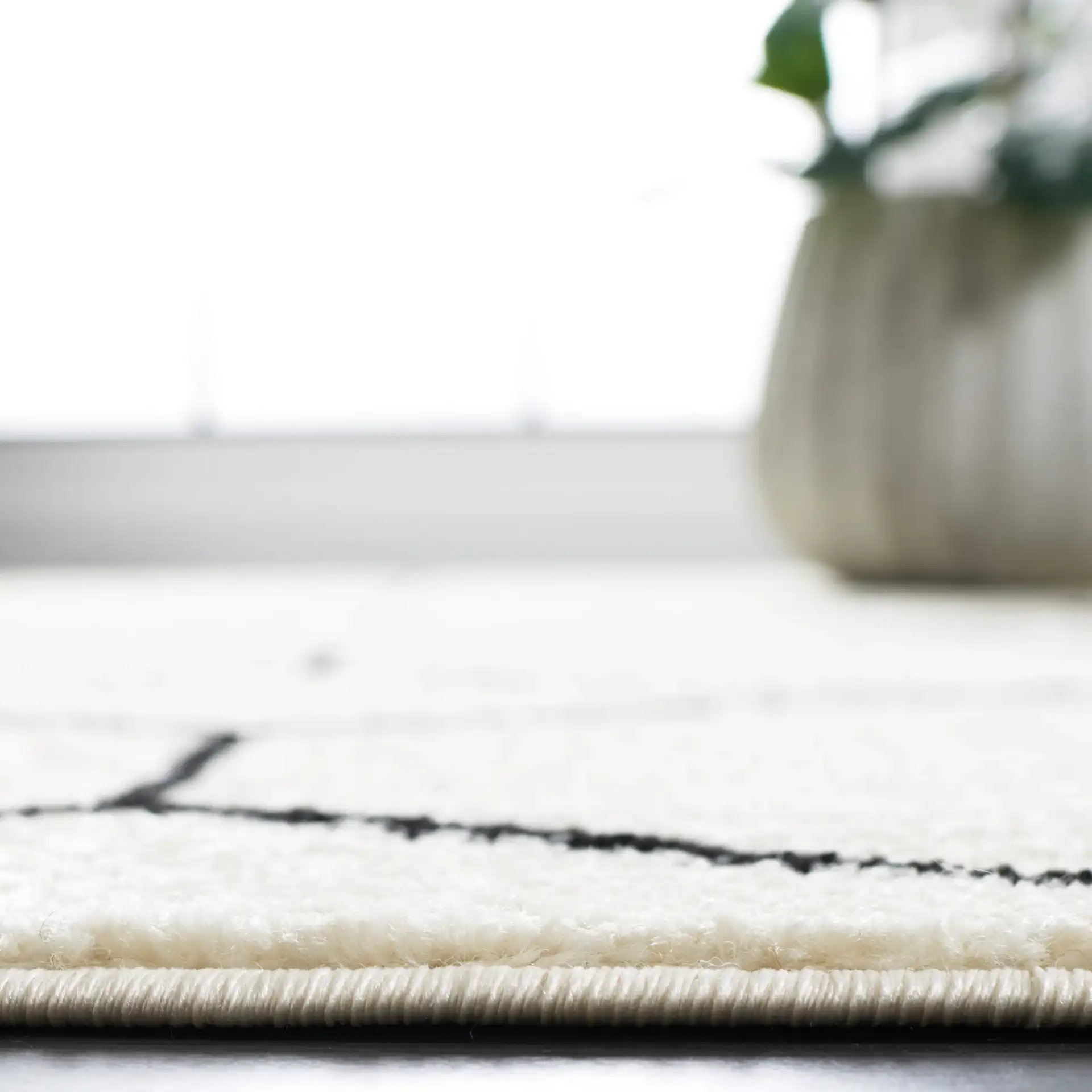 Tulum Geometric Rug in Ivory / Black in a styled room