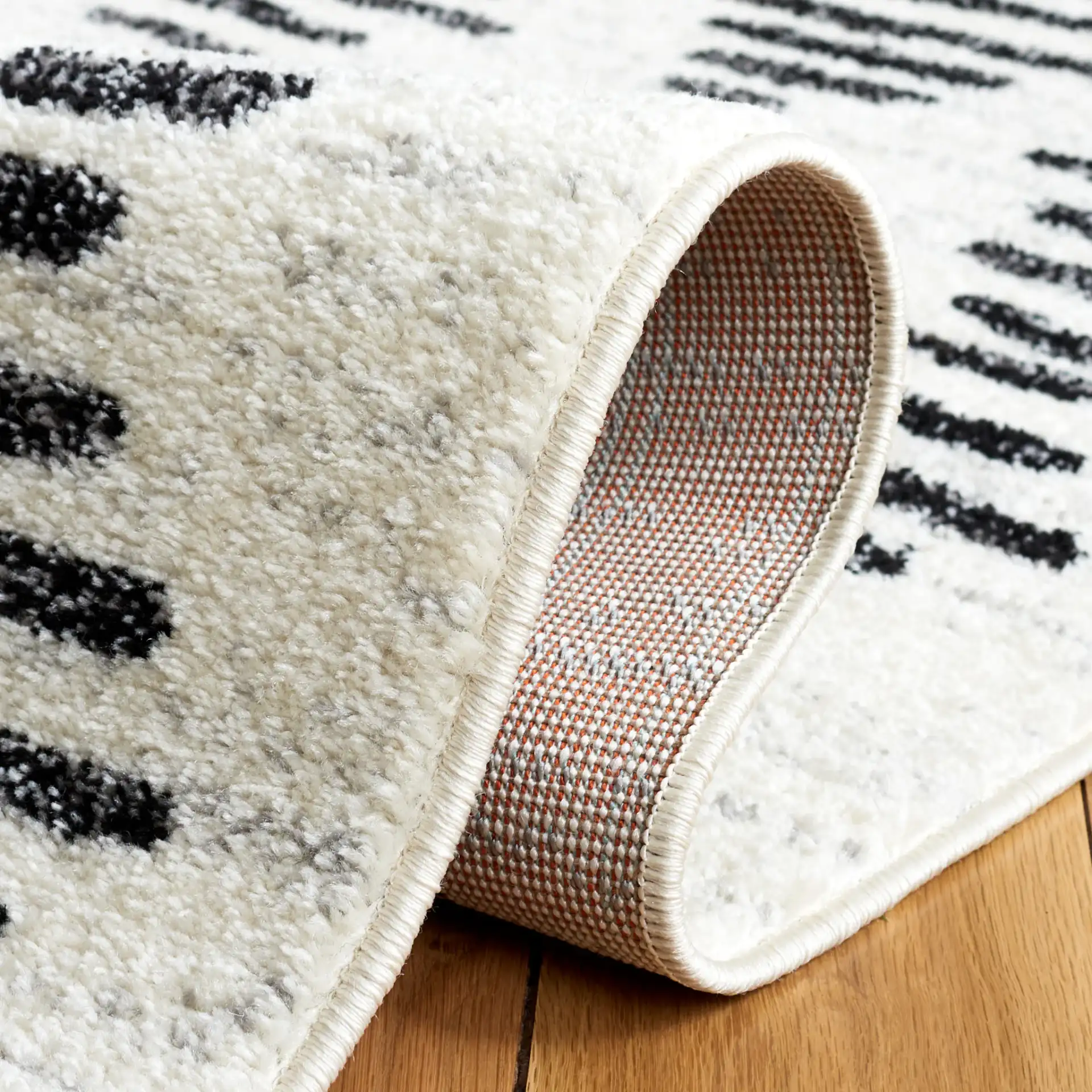Tulum Stacked Dash Rug in Ivory / Black in a styled room