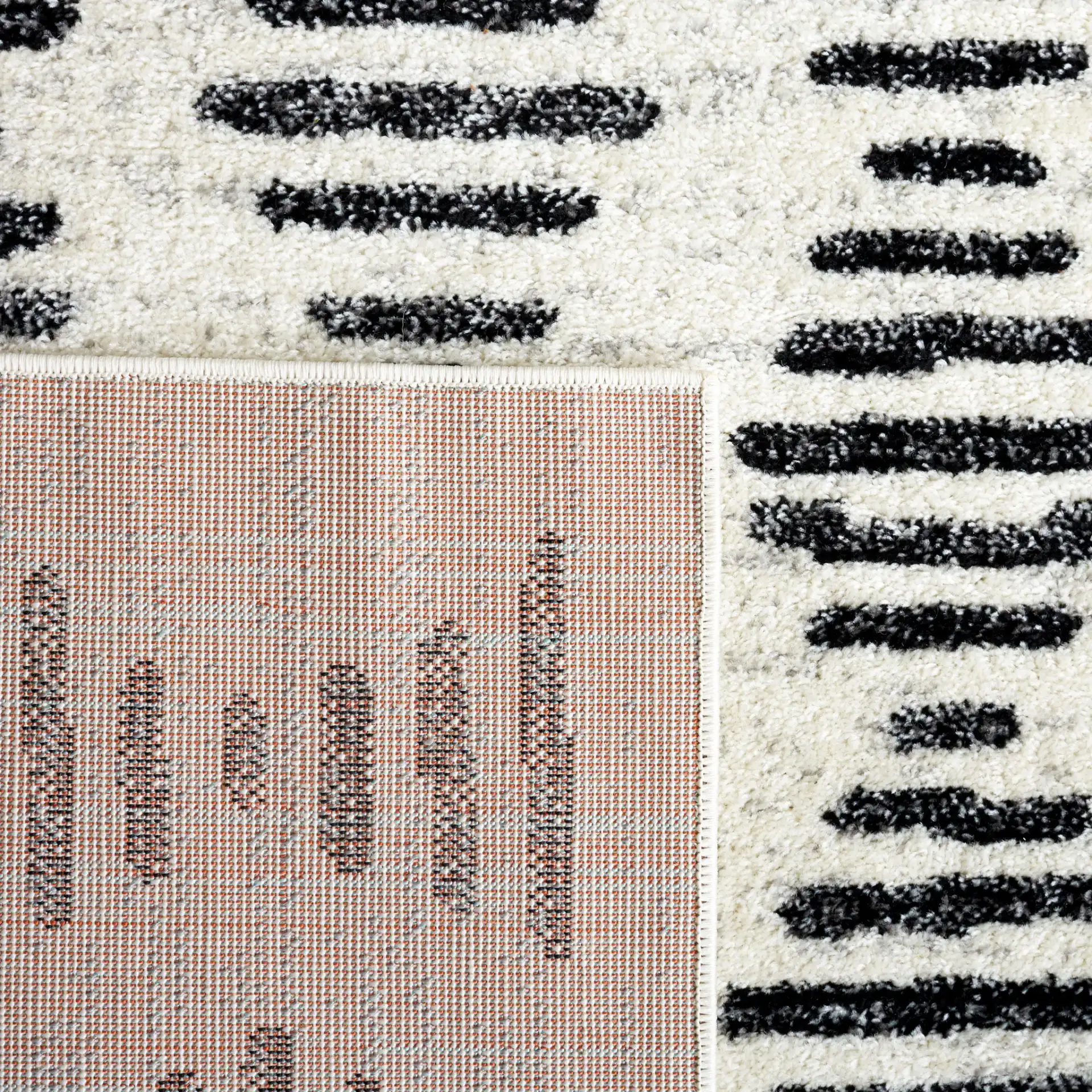 Tulum Stacked Dash Rug in Ivory / Black in a styled room