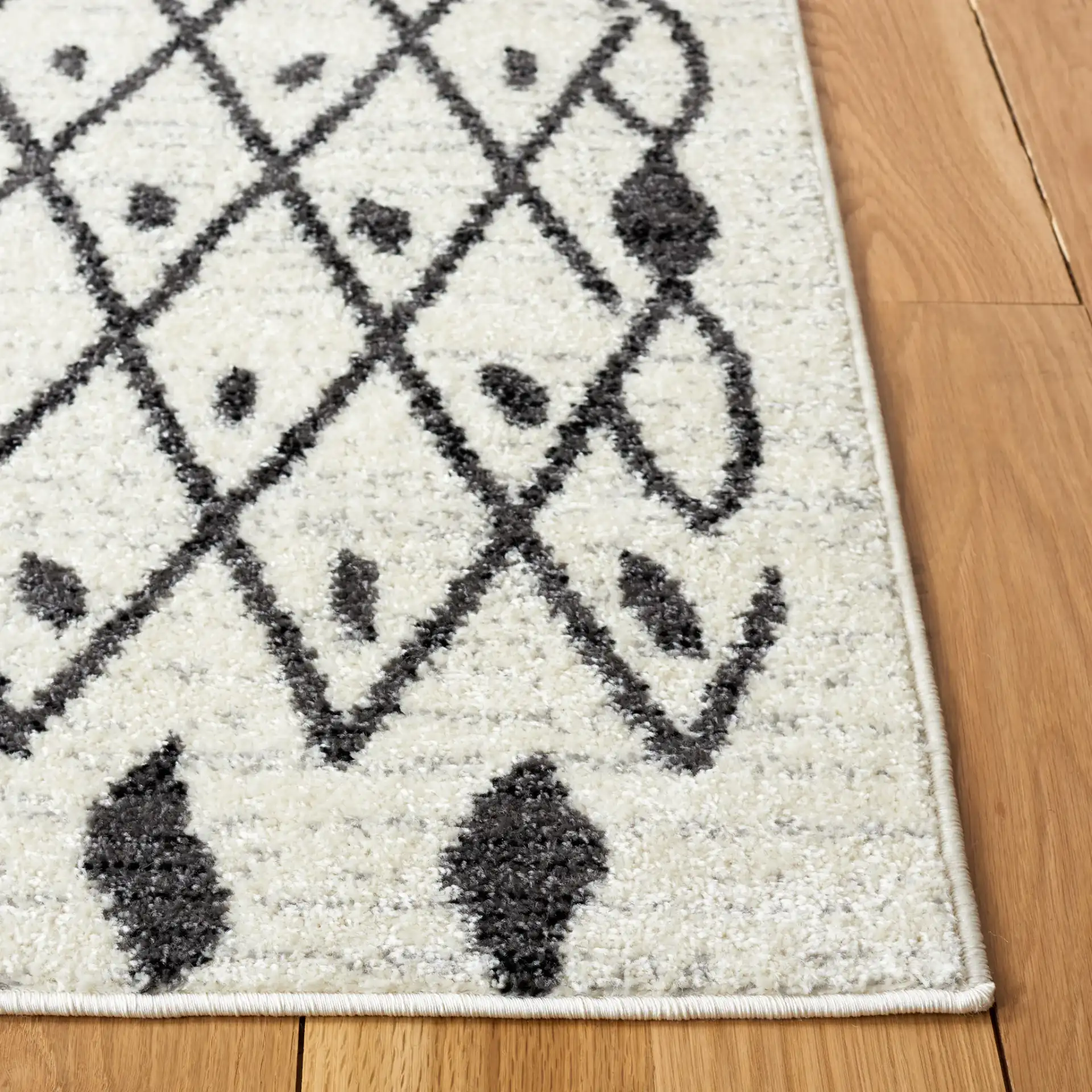 Tulum Leaf Trellis Rug in Ivory / Black in a styled room