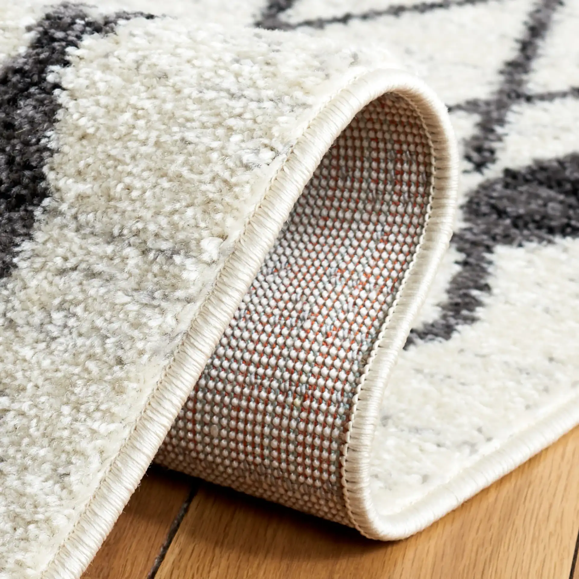Tulum Leaf Trellis Rug in Ivory / Black in a styled room