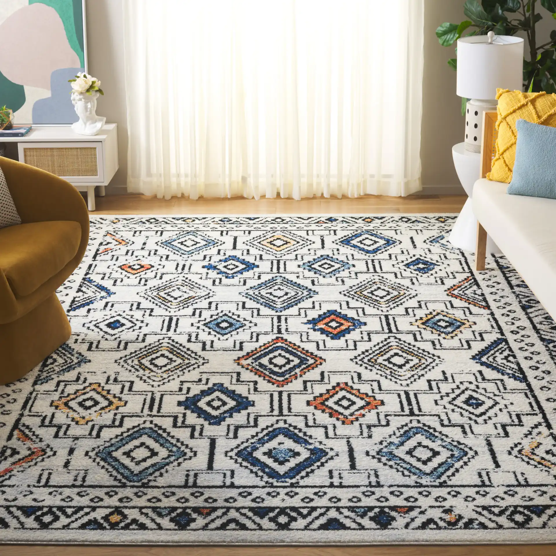Tulum Bordered Stepped Diamond Rug in Ivory Gray / Blue Rust in a styled room