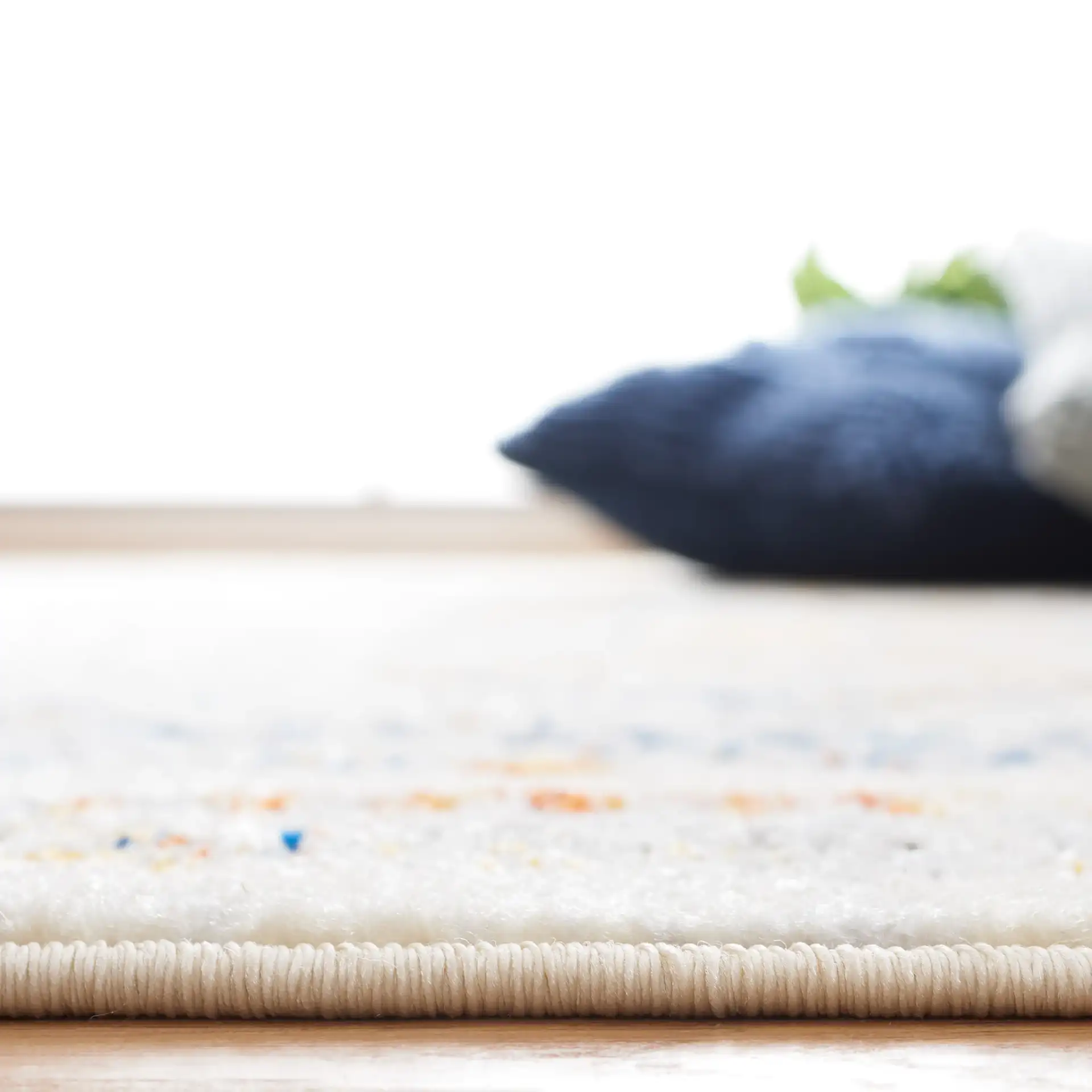 Tulum Geometric Panel Rug in Ivory Gray / Blue Rust in a styled room