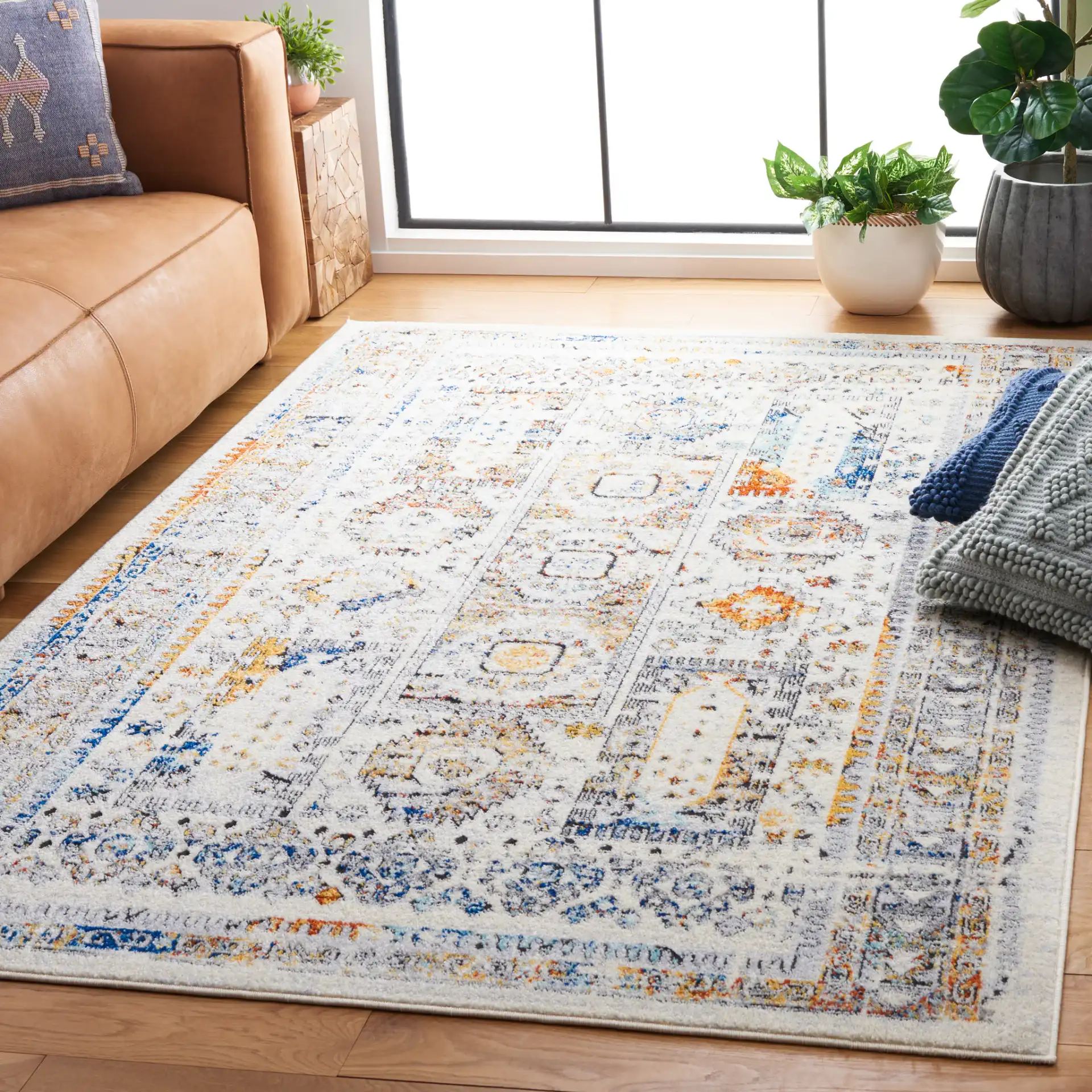 Tulum Geometric Panel Rug in Ivory Gray / Blue Rust in a styled room
