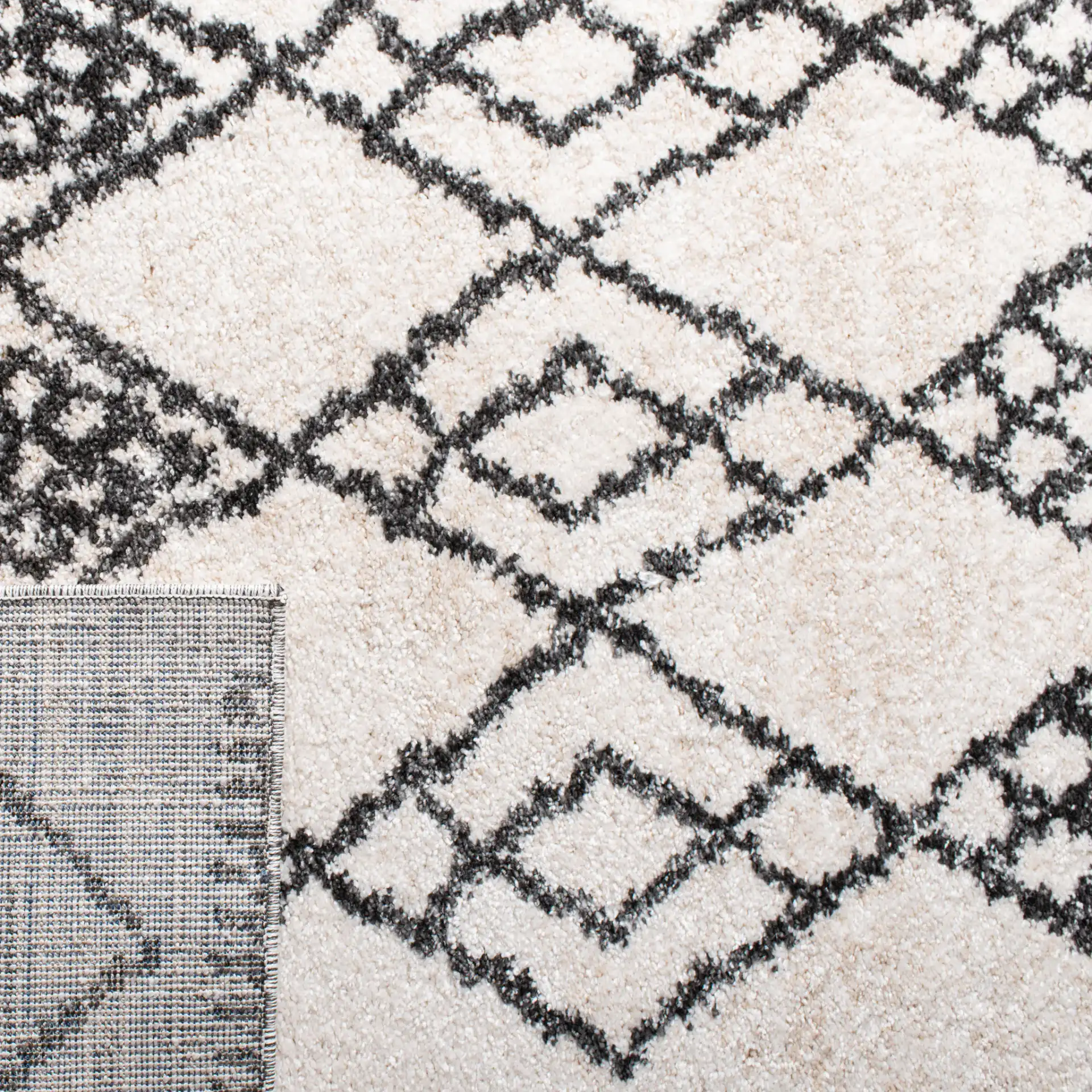 Tunisia Moroccan Diamond Trellis Rug in Ivory / Black in a styled room