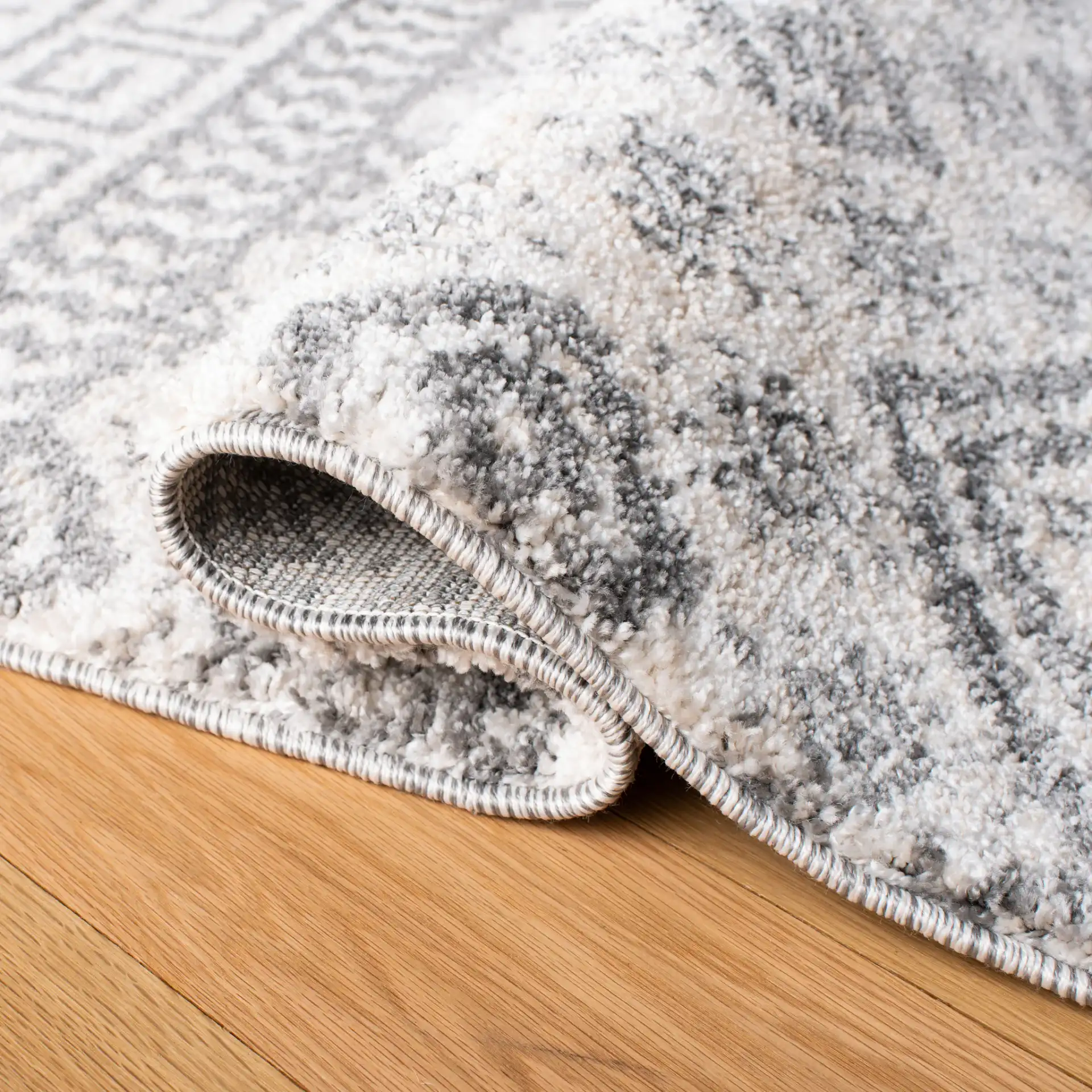 Tunisia Banded Diamond Rug in Ivory / Black in a styled room