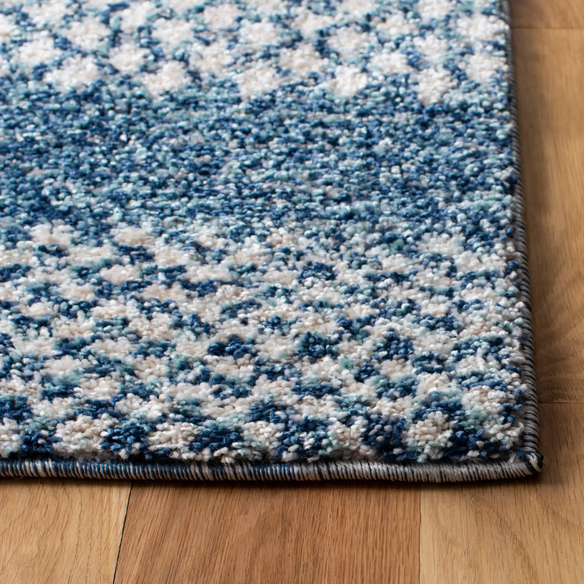 Tunisia Tribal Diamond Rug in Navy / Ivory in a styled room