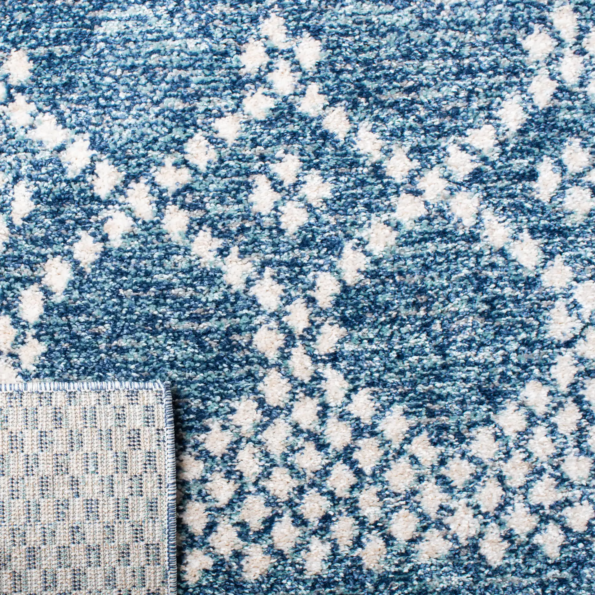 Tunisia Tribal Diamond Rug in Navy / Ivory in a styled room