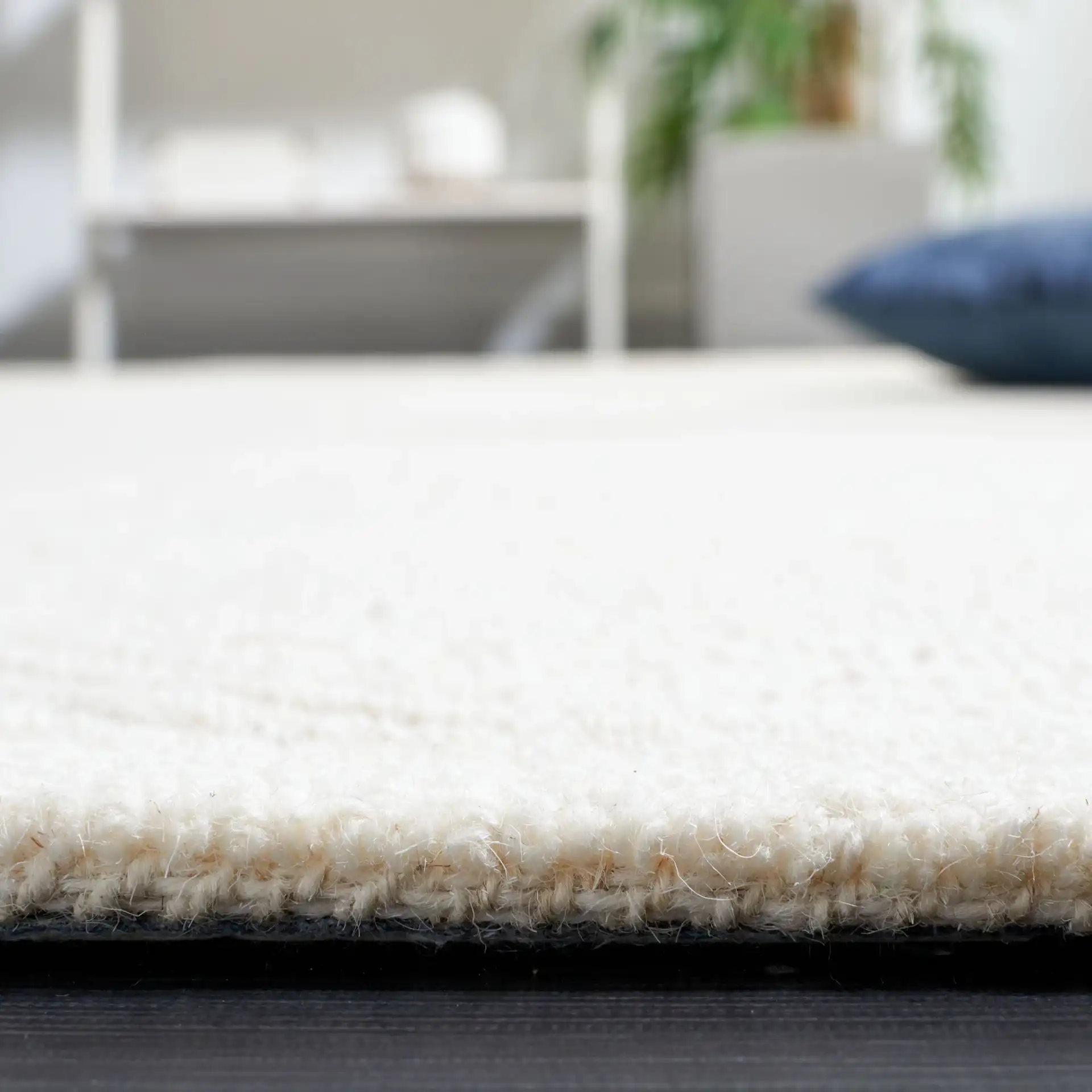Textural Triangle Grid Hand-Tufted Wool Rug in Ivory in a styled room
