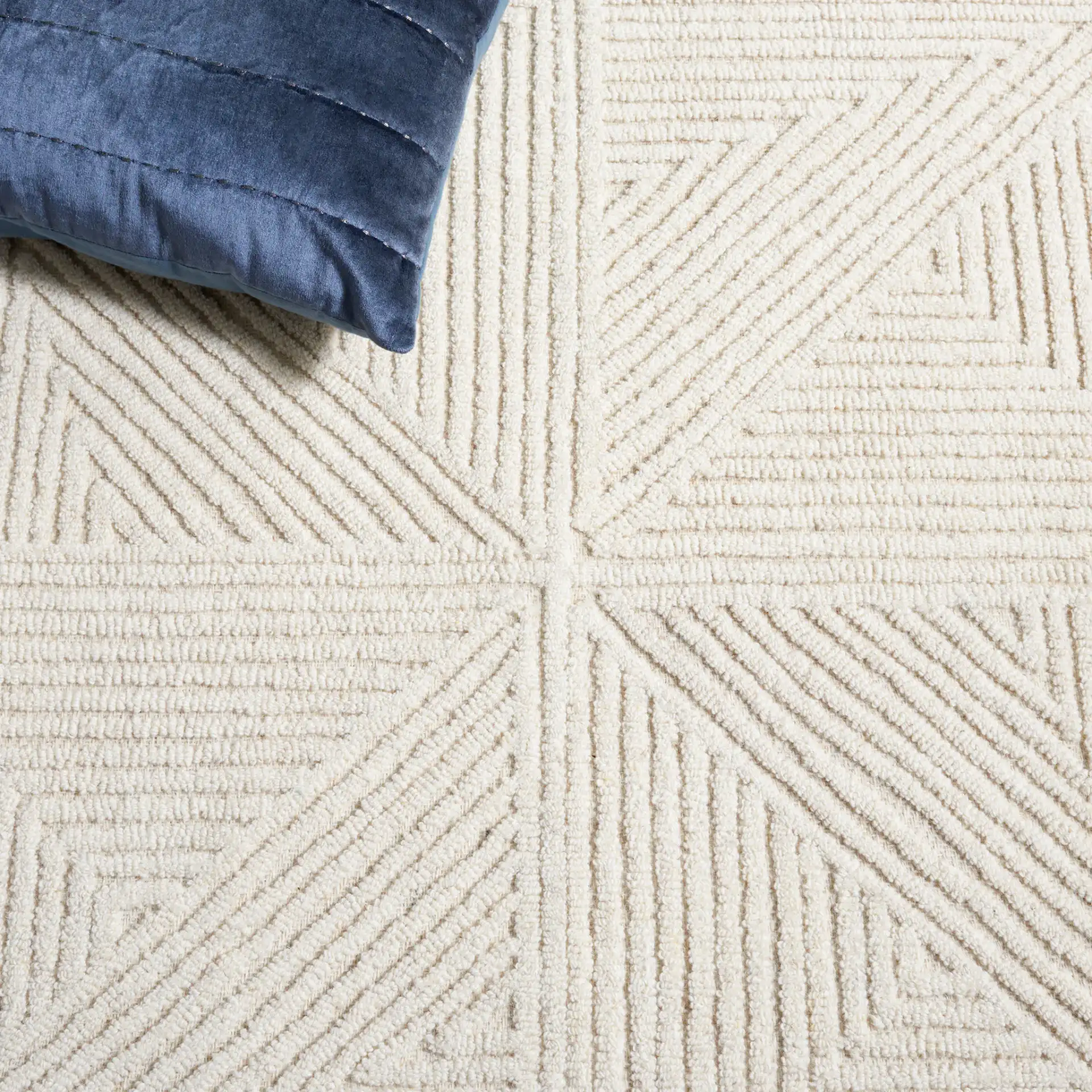 Textural Triangle Grid Hand-Tufted Wool Rug in Ivory in a styled room