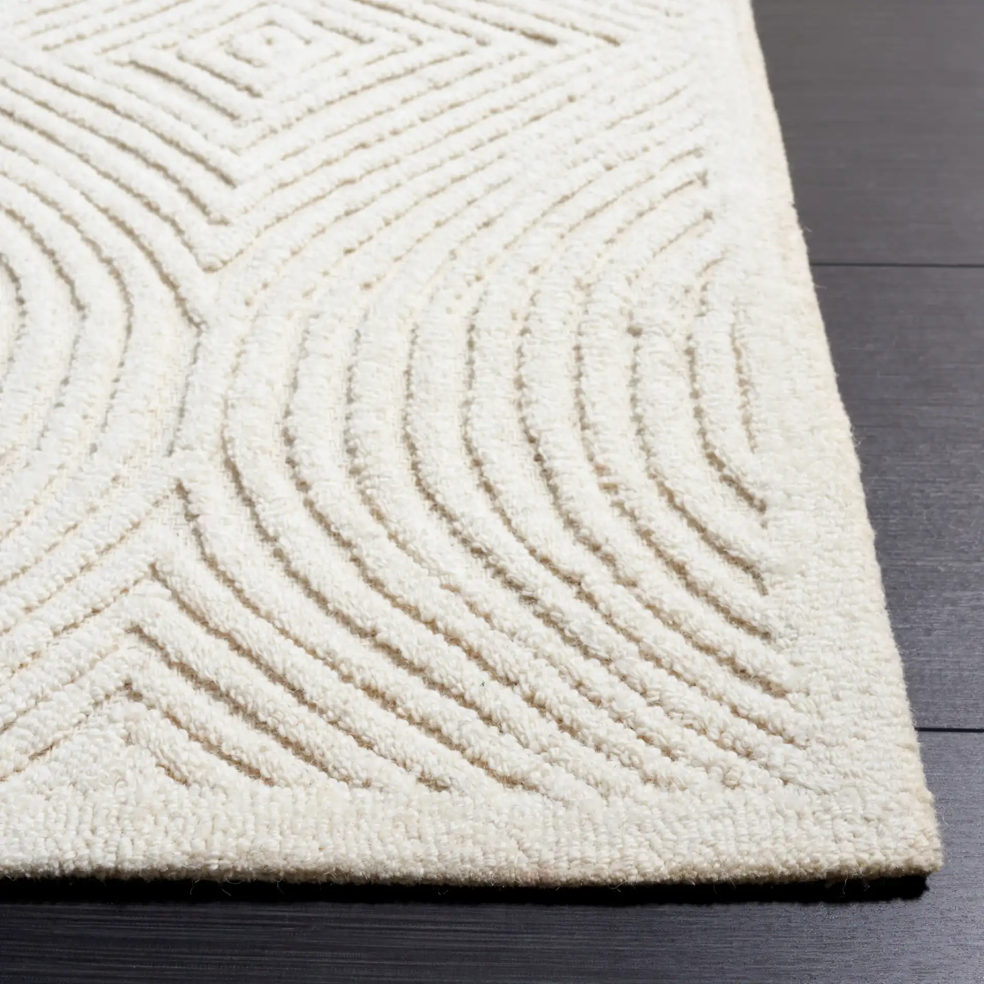Textural Modern Concentric Diamond Hand-Tufted Wool Rug in Ivory in a styled room