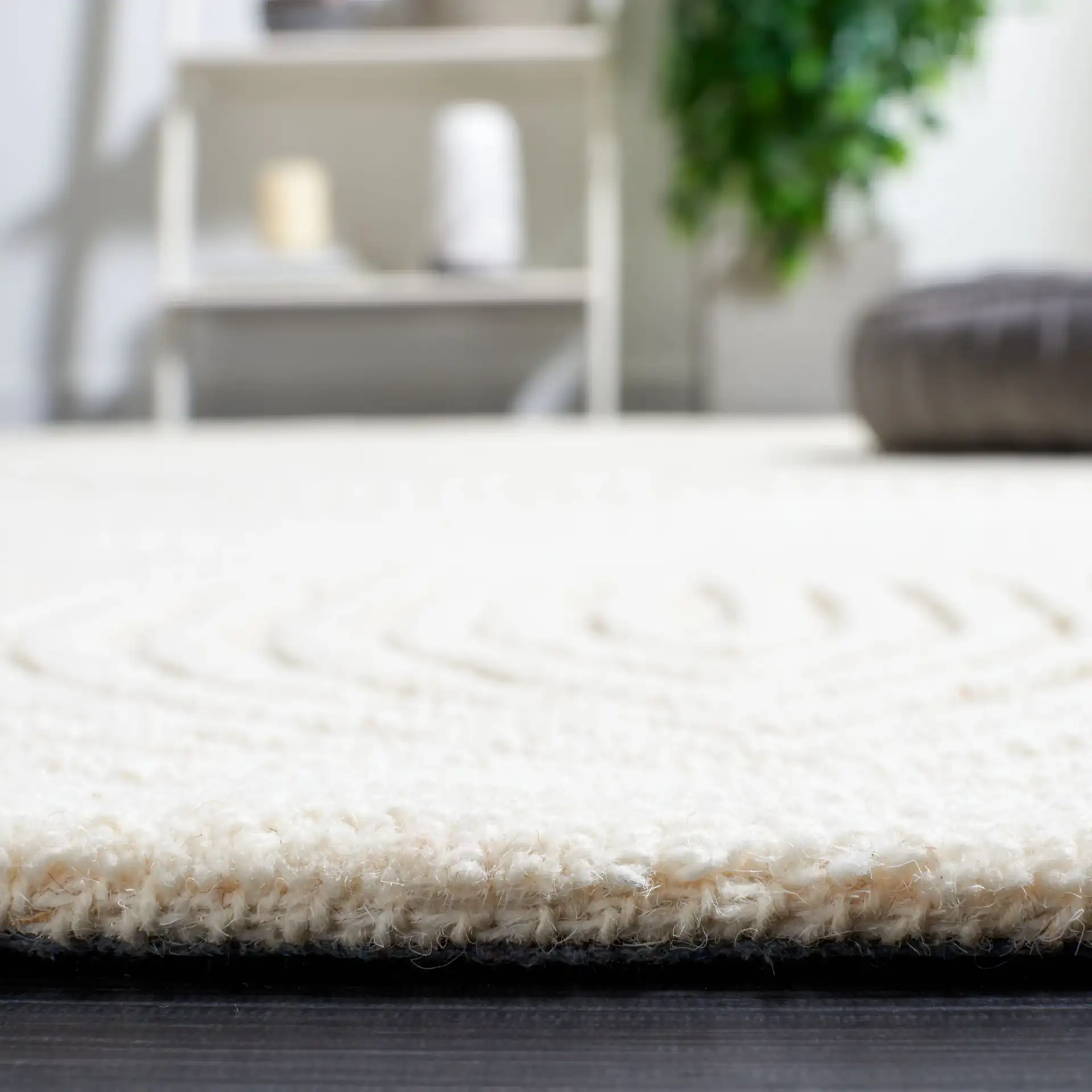 Textural Modern Concentric Diamond Hand-Tufted Wool Rug in Ivory in a styled room