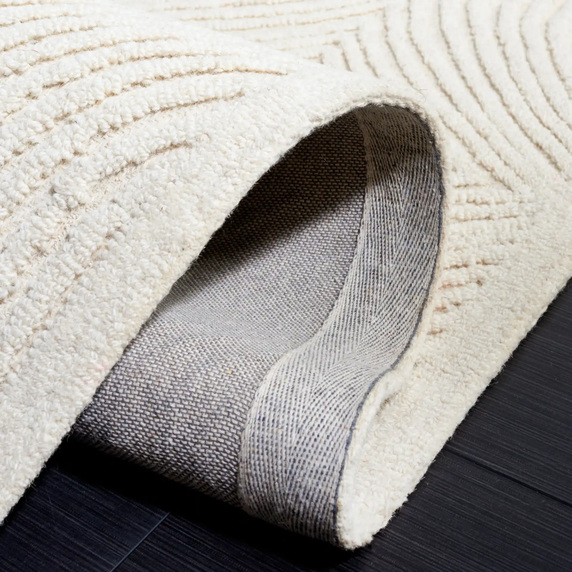 Textural Modern Concentric Diamond Hand-Tufted Wool Rug in Ivory in a styled room